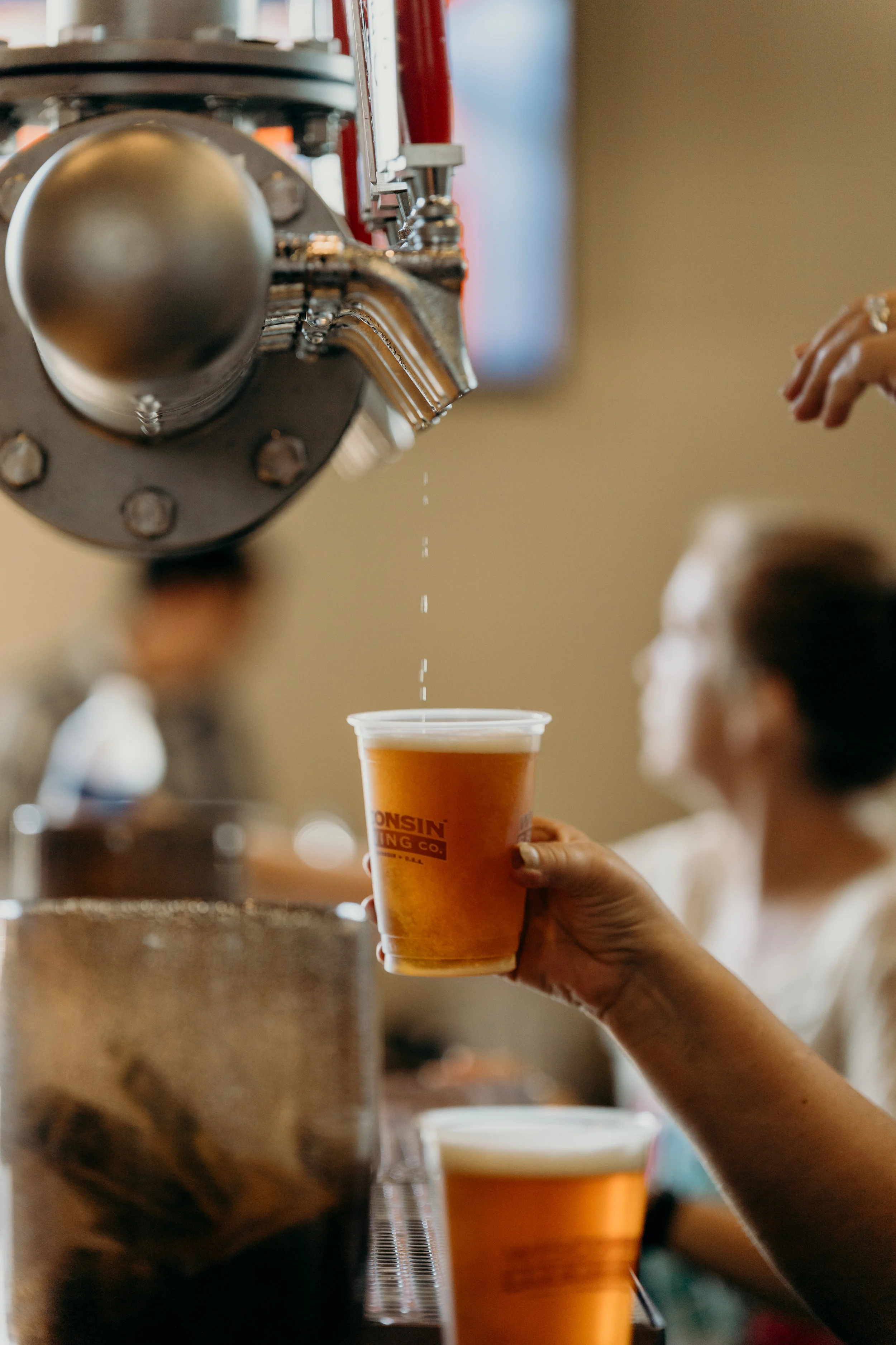 Beer drips from the tap.