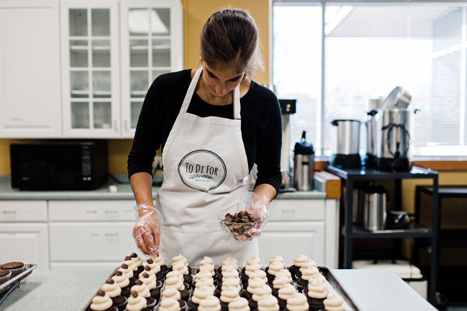 Diana putting toppers on cupcakes