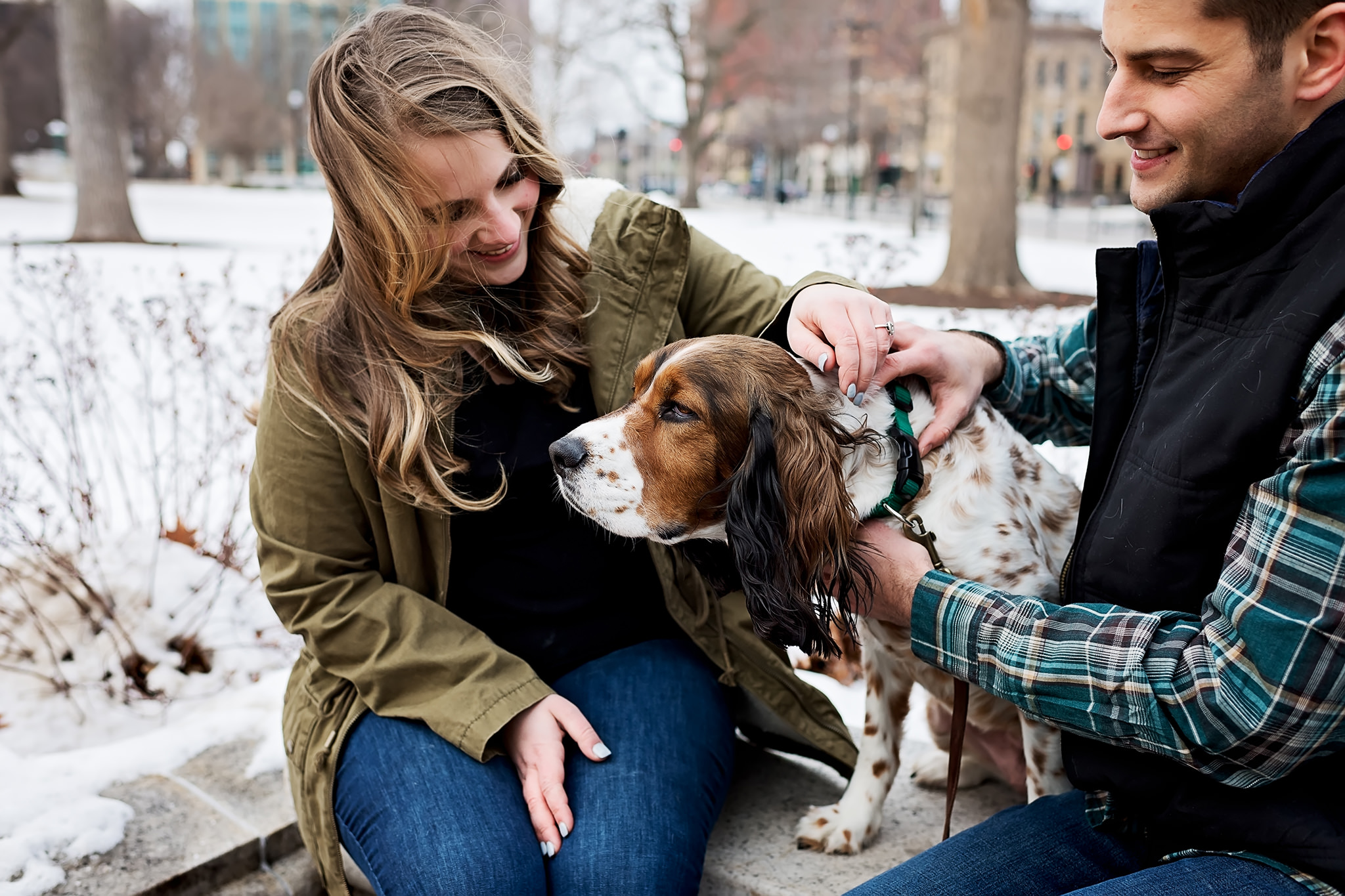 Couple petting dog