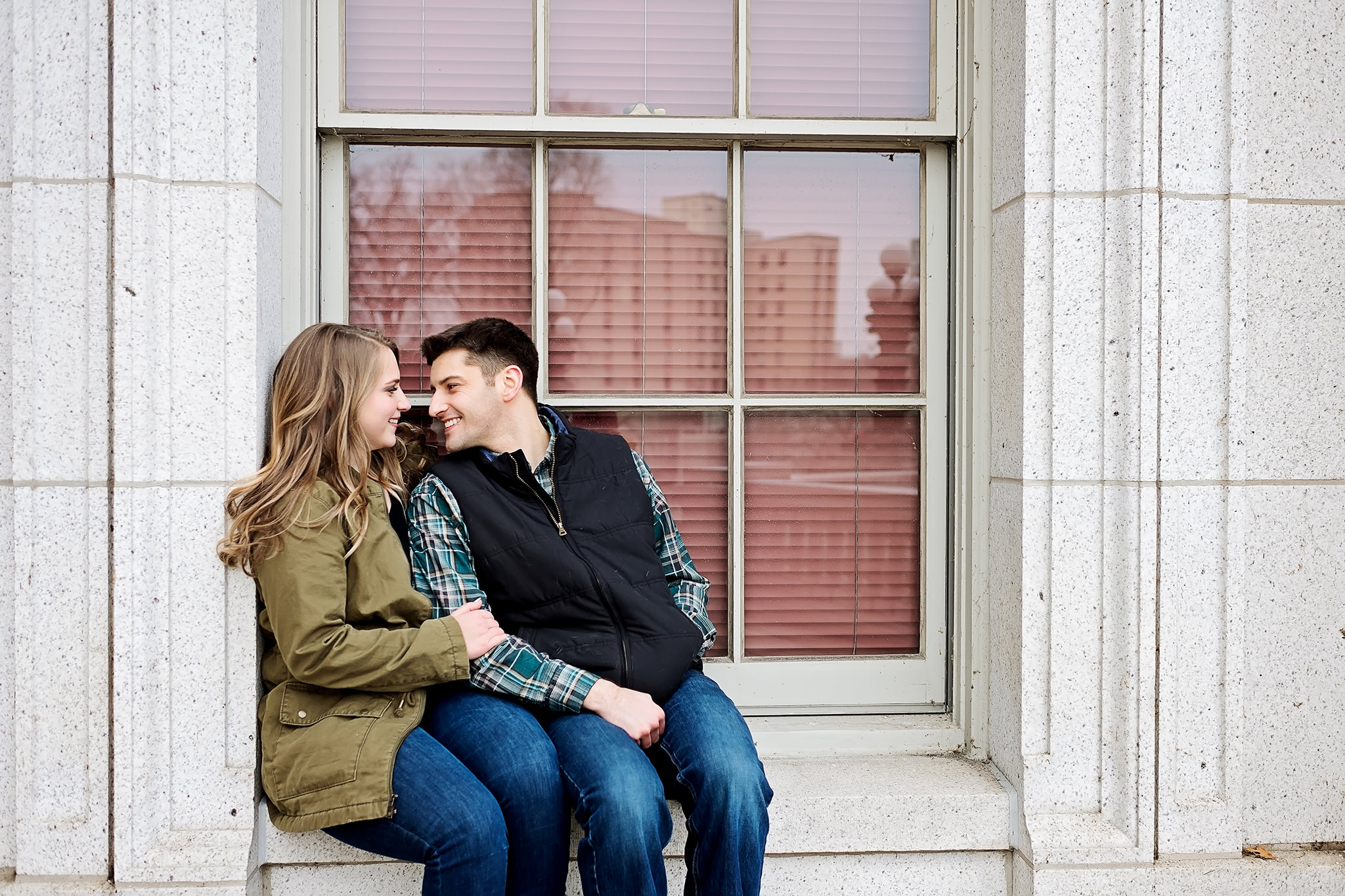 Couple sitting in window sill at Wisconsin state capitol