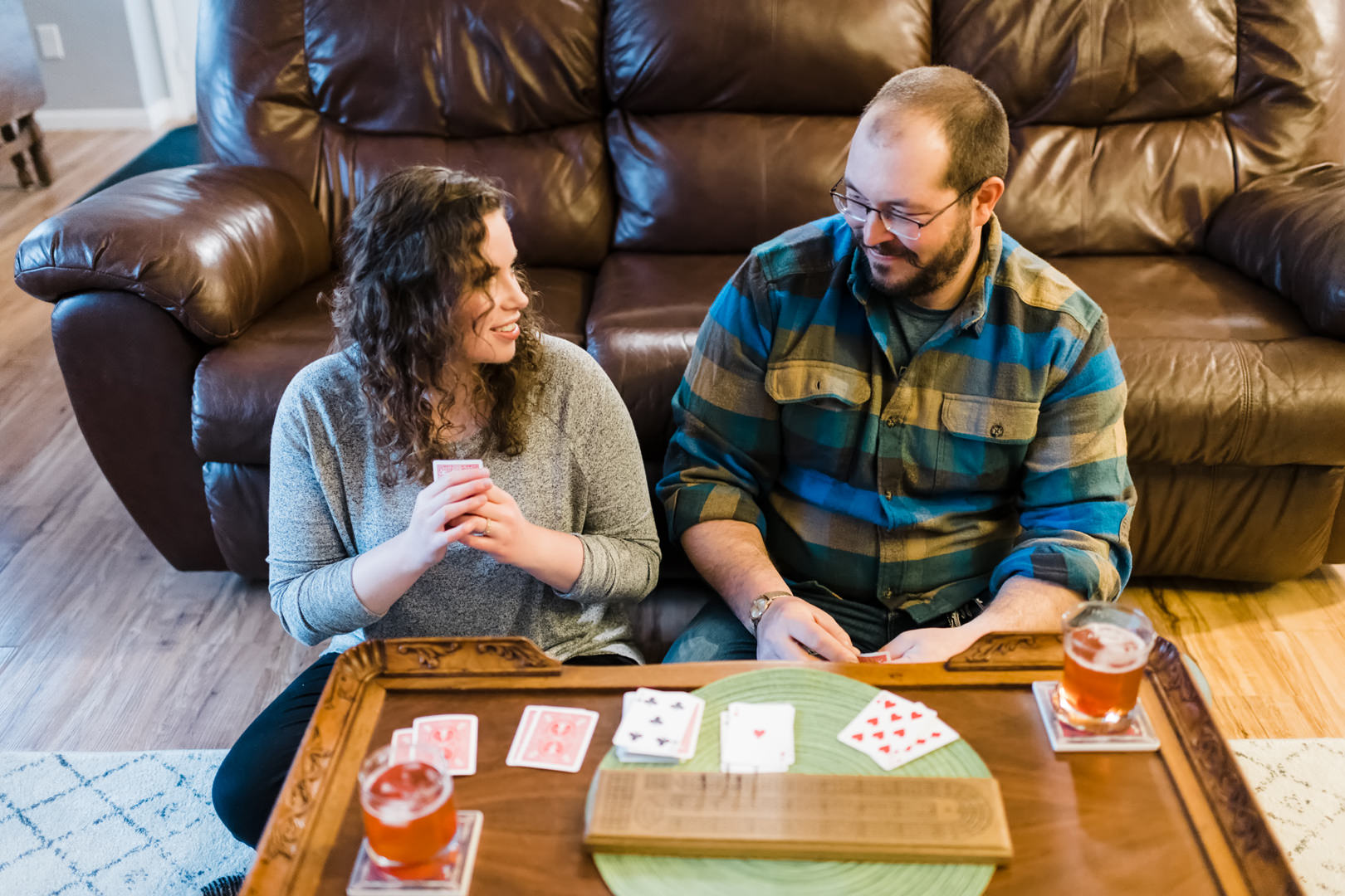 Couple playing cribbage in their home