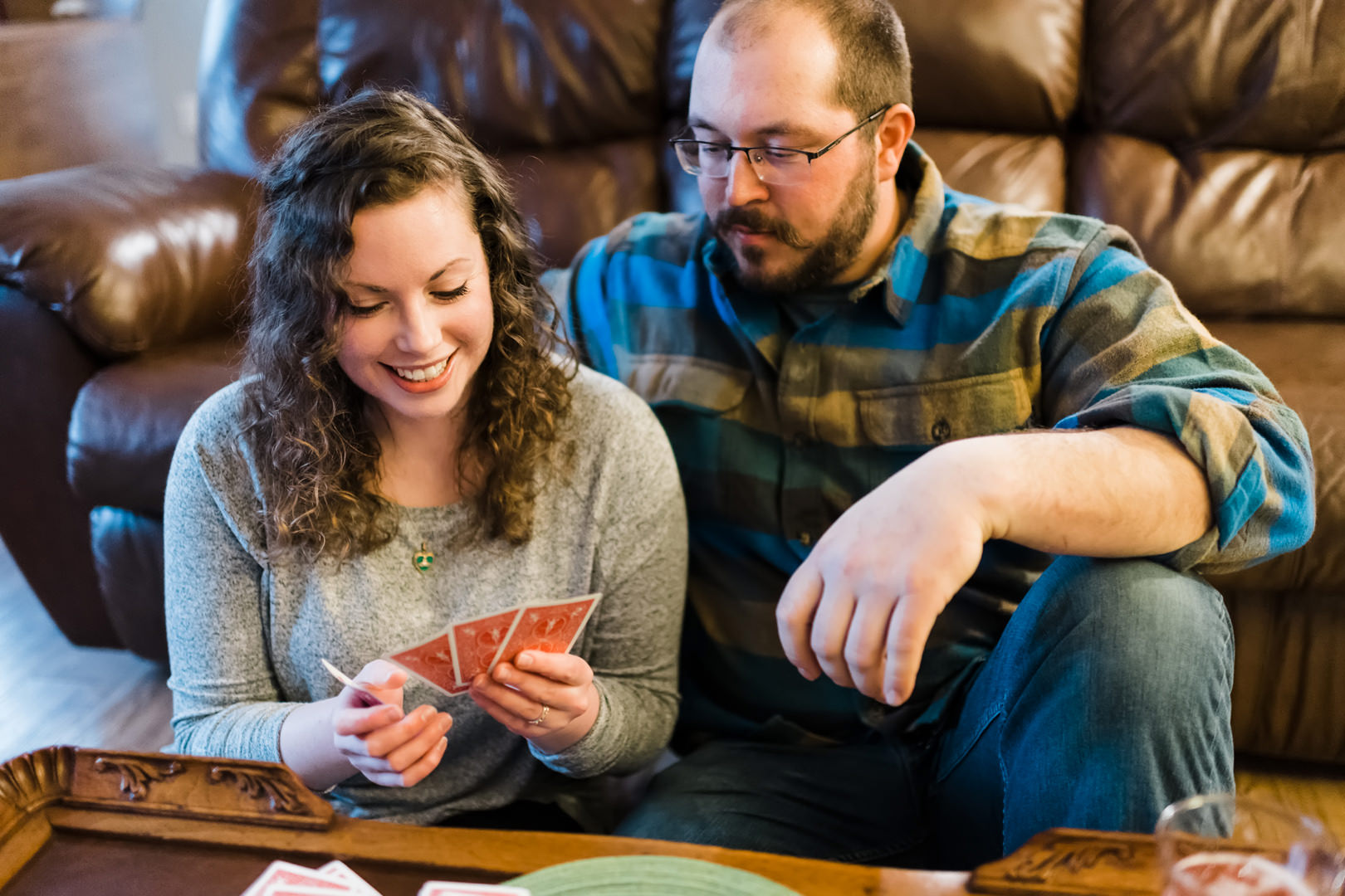Woman smiles at her good cribbage hand