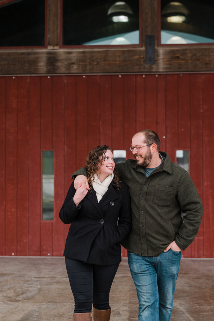 Engaged couple walking and laughing