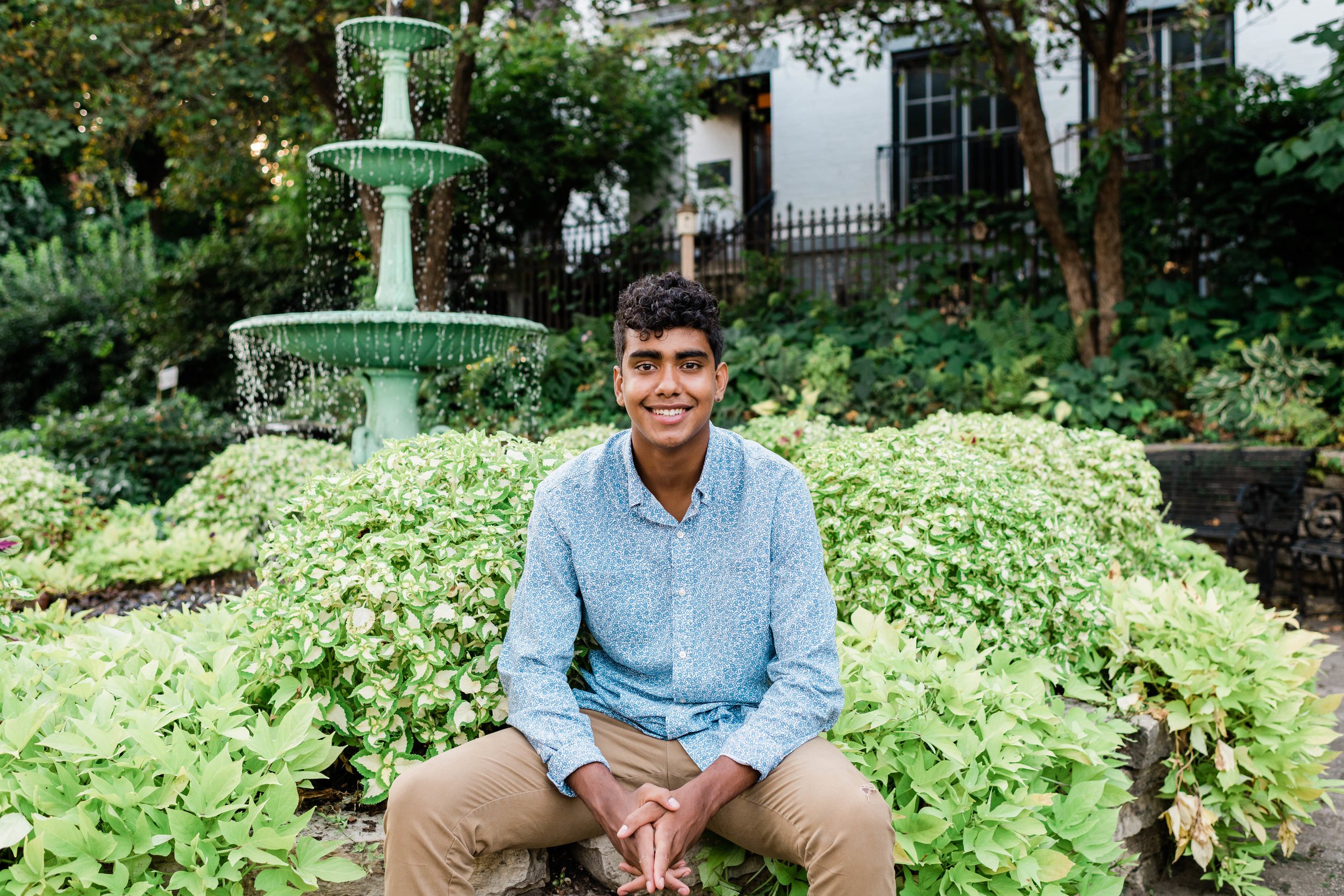 High school senior sitting at Period Garden Park in downtown Madison, Wisconsin