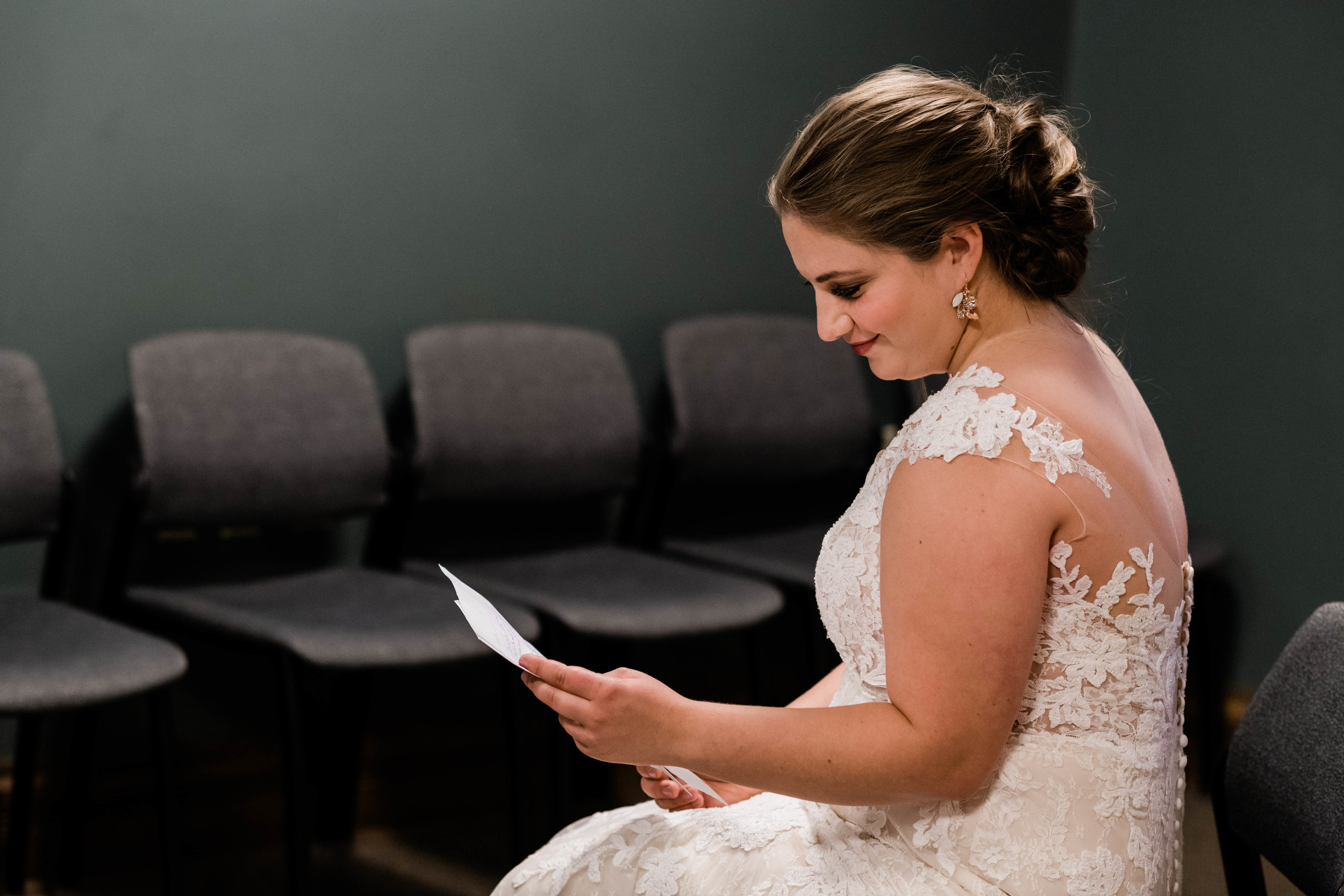 Bride reading a letter from her groom