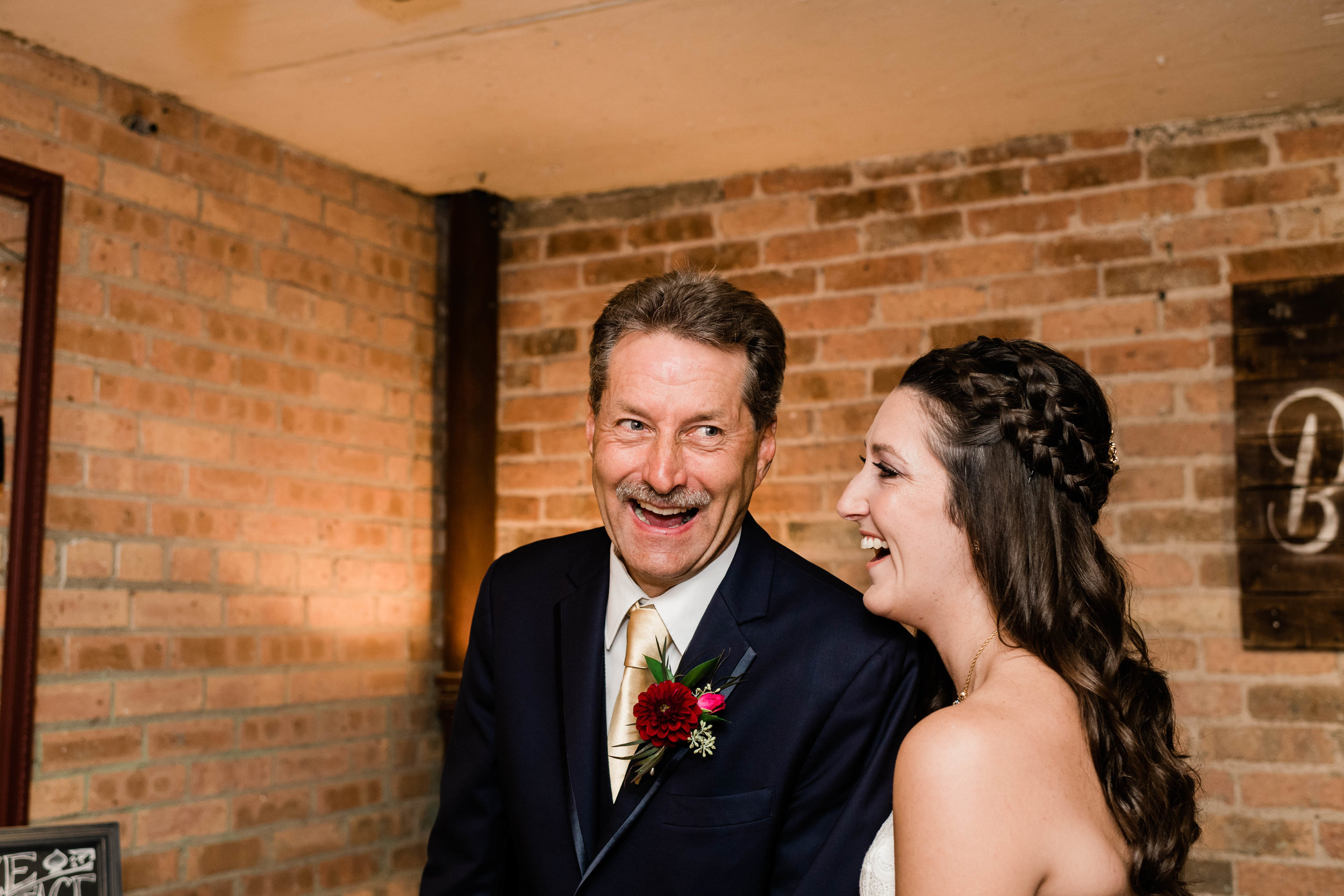 Bride and her father laughing