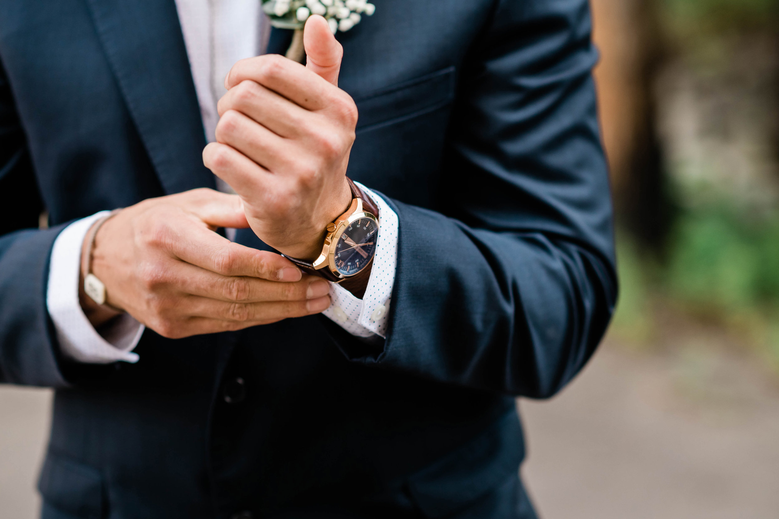 Groom putting on his watch