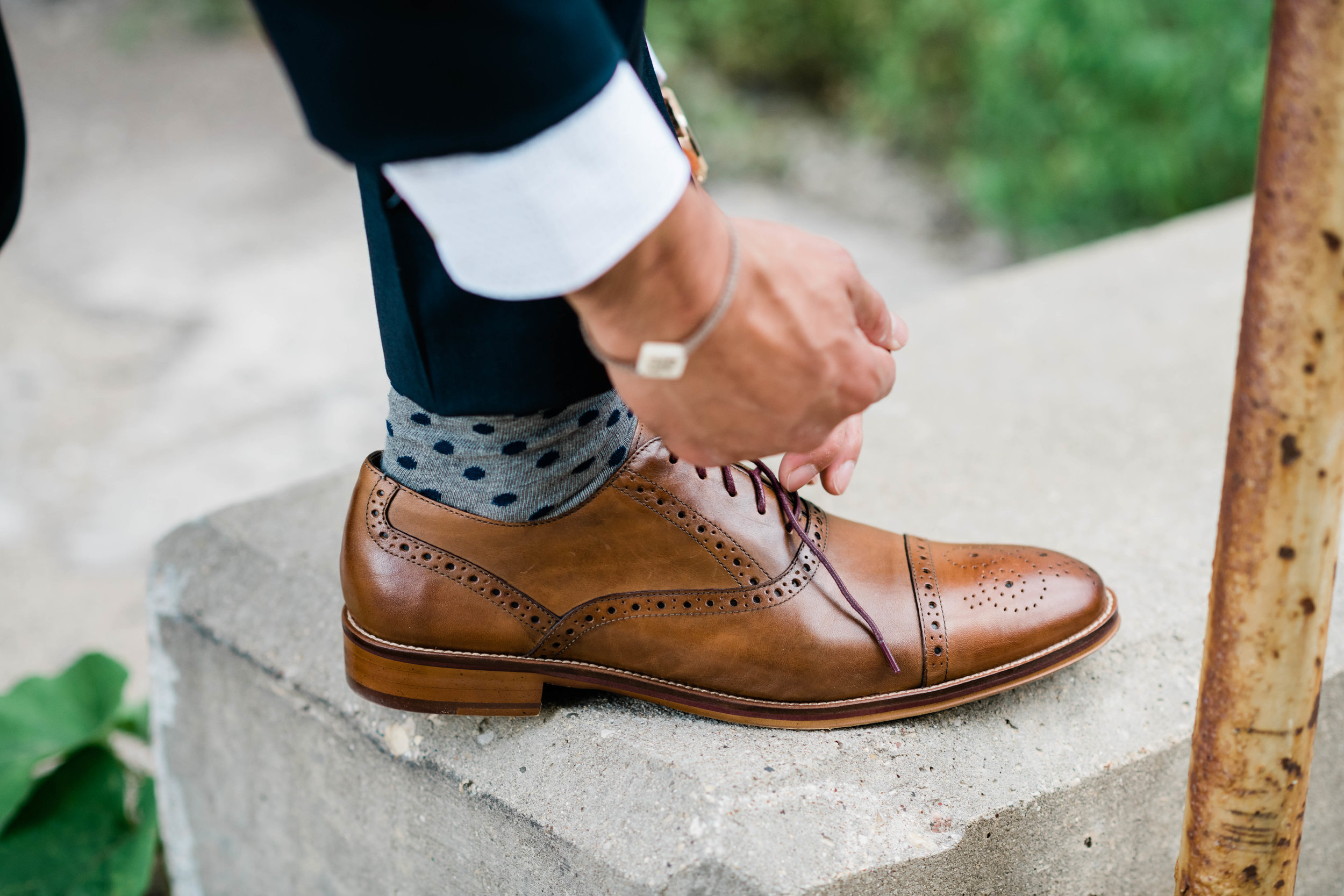 Groom tying his shoe