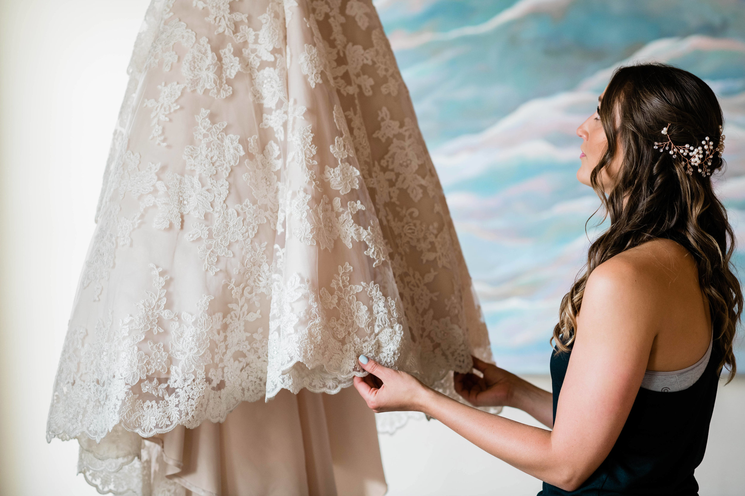 Bride looking at her dress