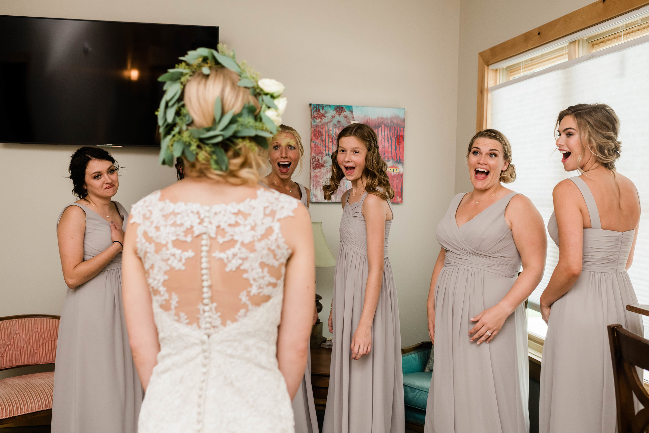 Bridesmaids react to their first look of bride
