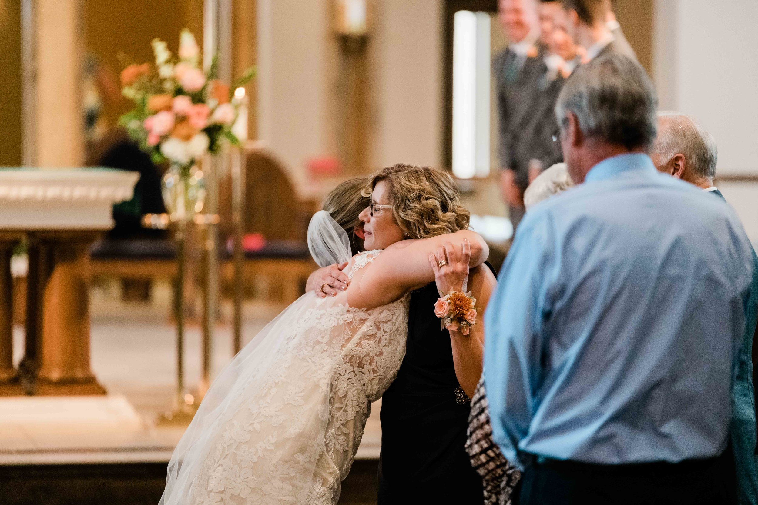 Bride hugs her new mother in law