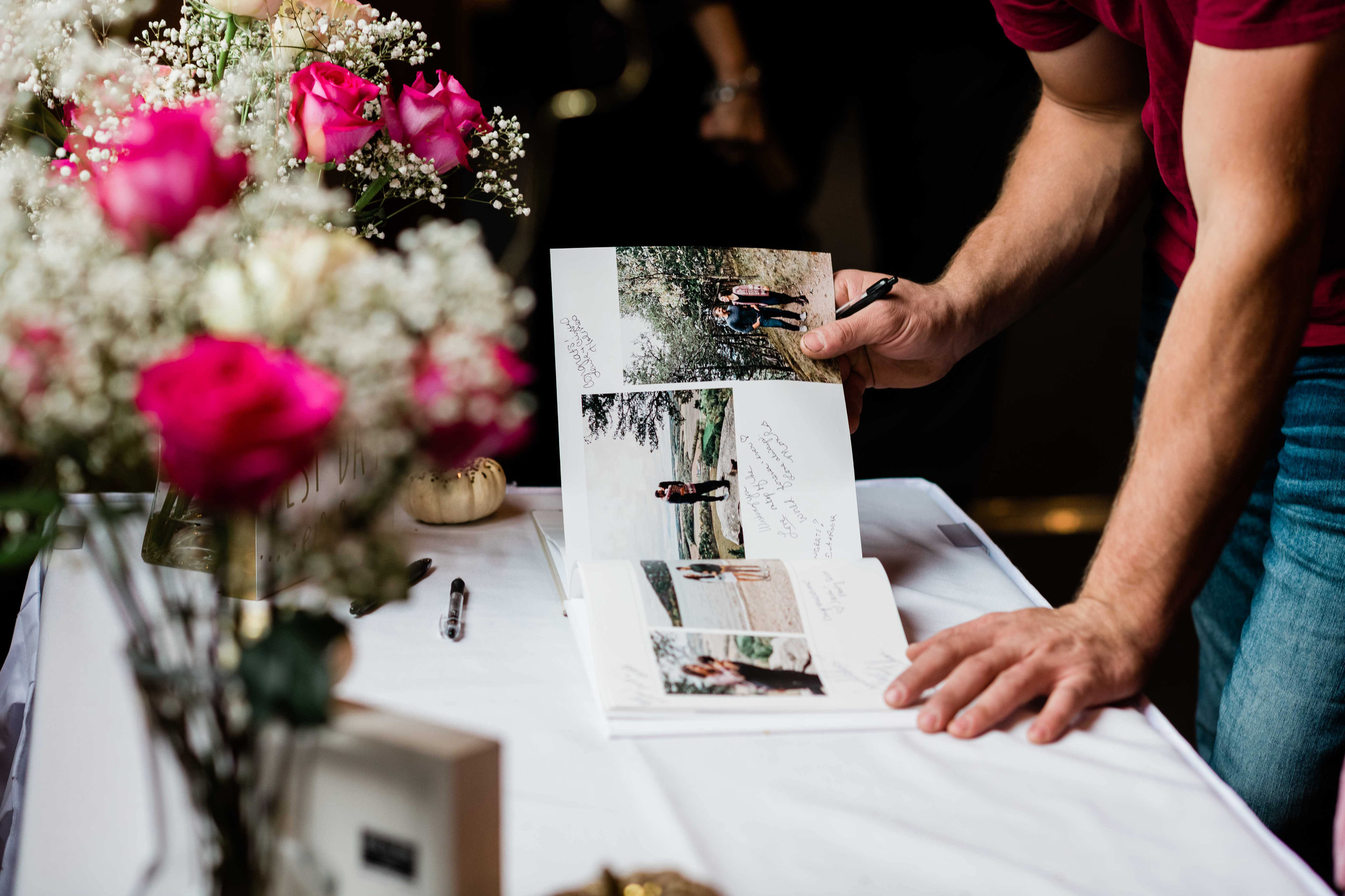 Wedding guest looks through the photo guest book