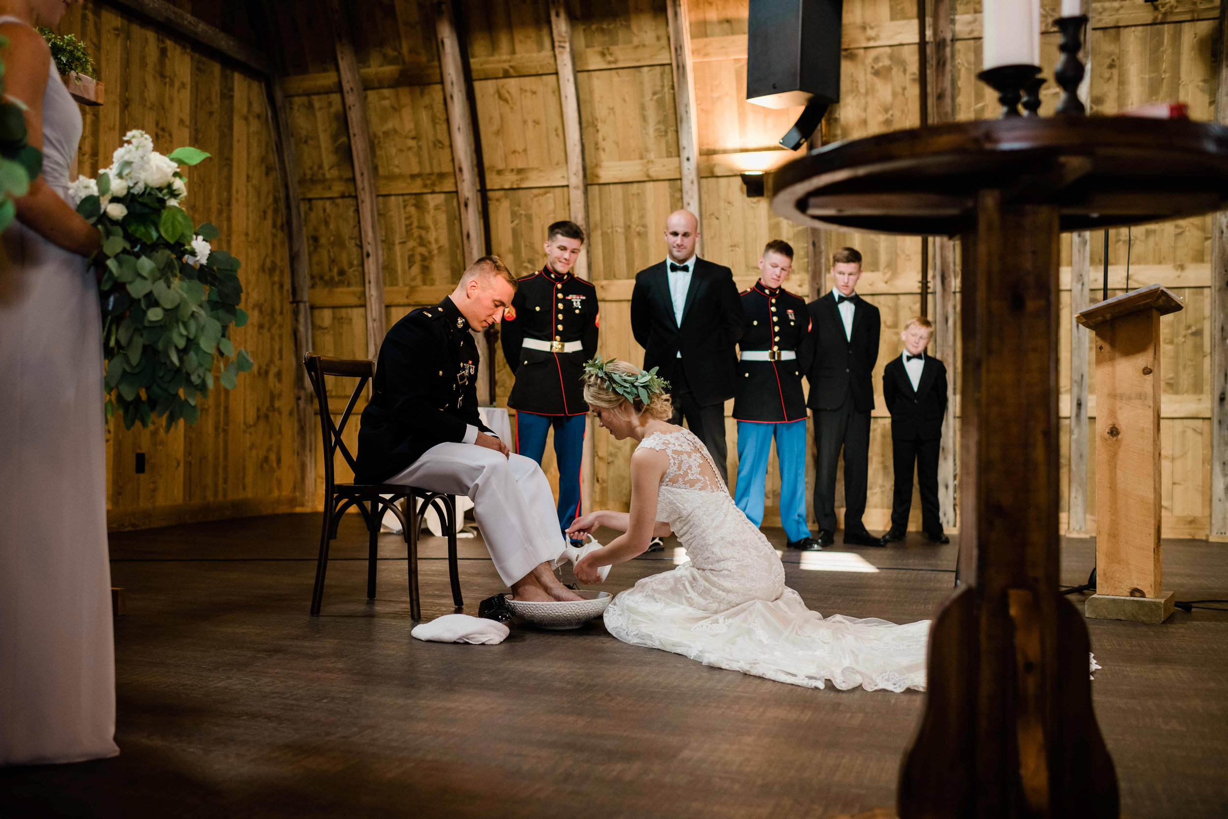 Bride and groom during foot washing ceremony