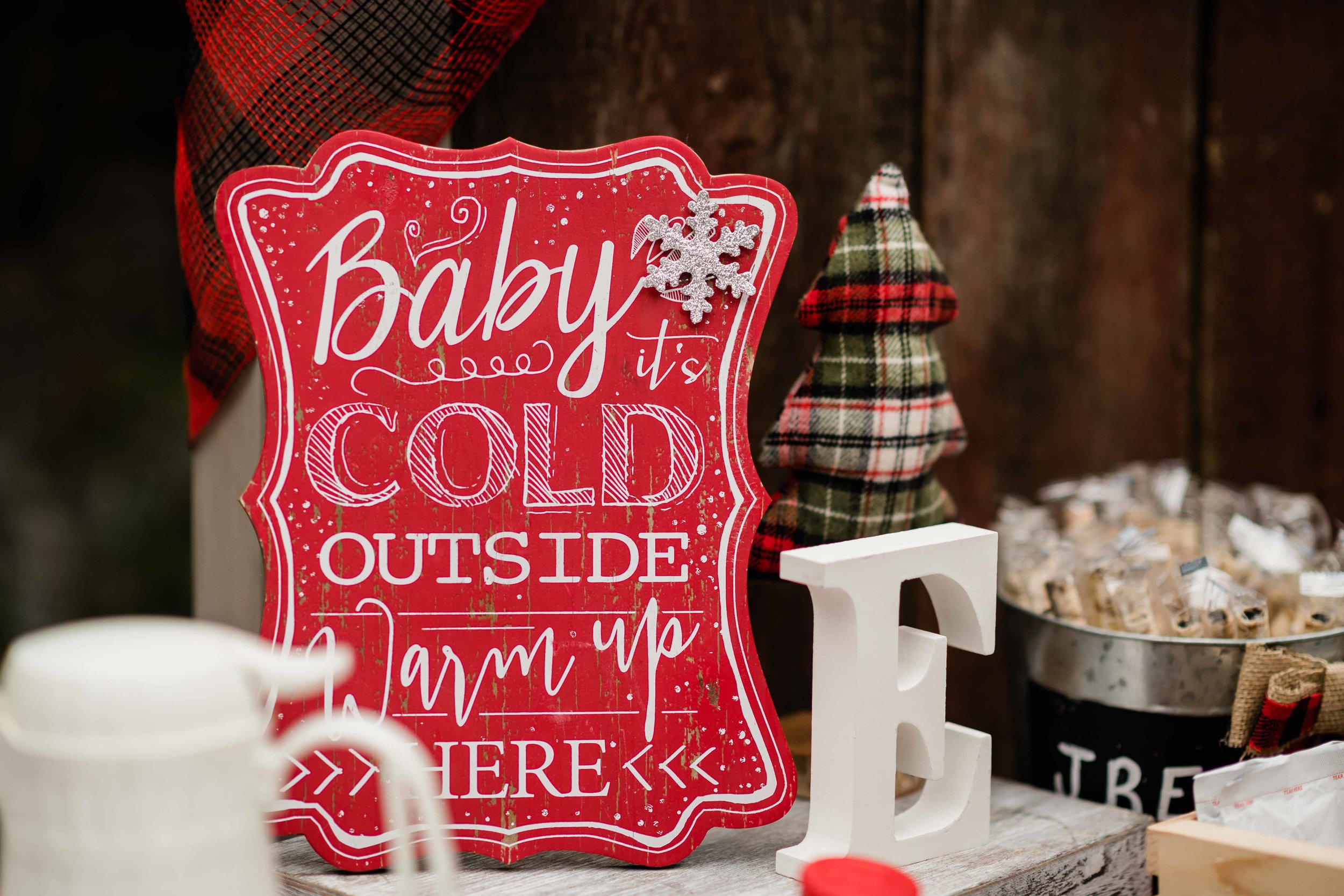 Baby it's cold outside sign for outdoor winter wedding