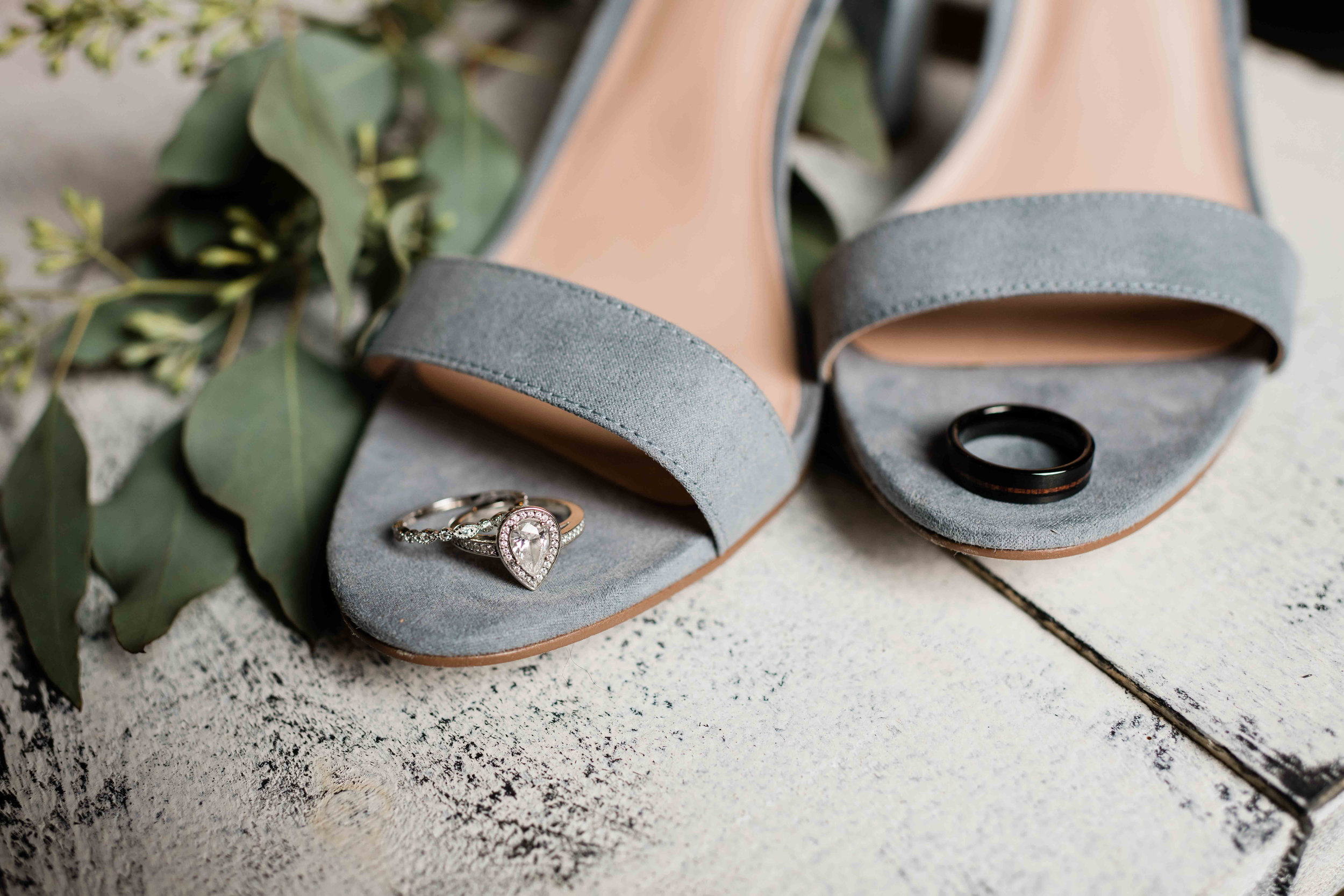 Wedding rings on bride's shoes