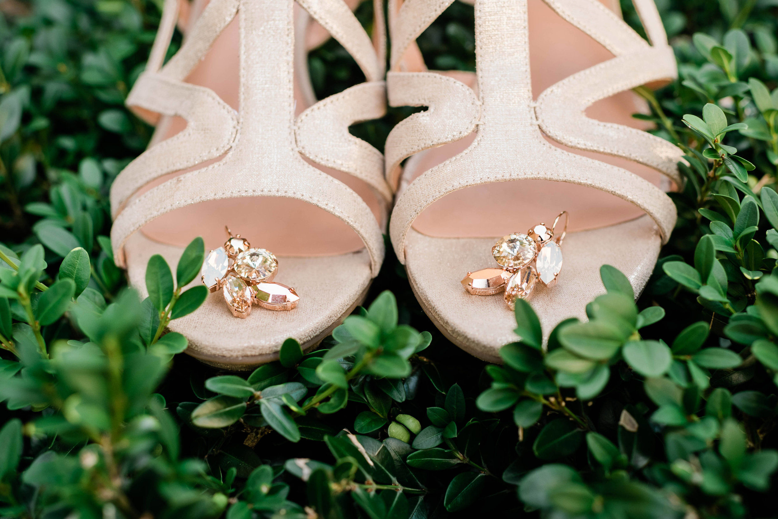 Bride's earrings on her shoes