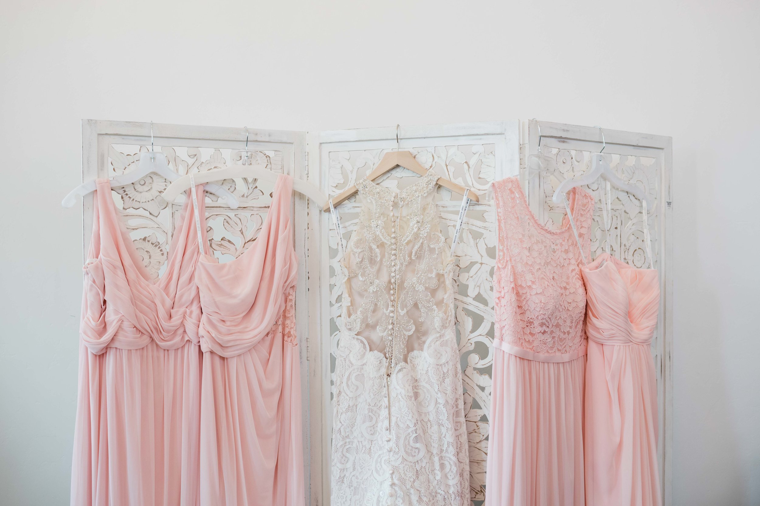 Bridal and bridesmaids gowns hanging up