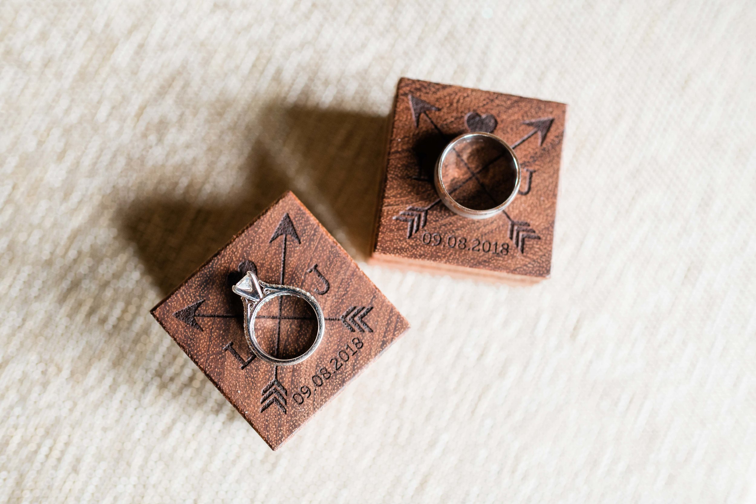Wedding rings on personalized wooden ring boxes