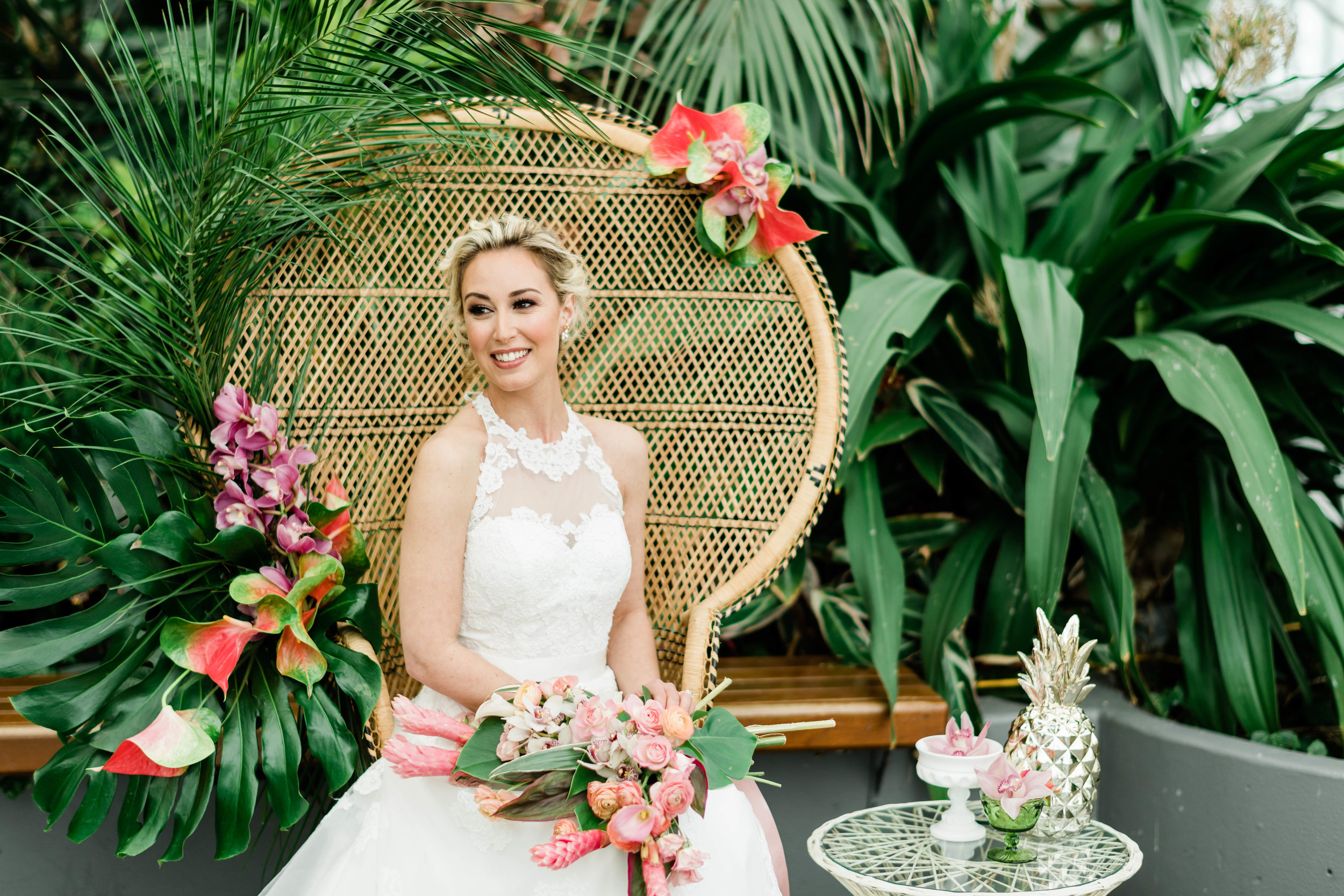 Bride sitting in peacock chair