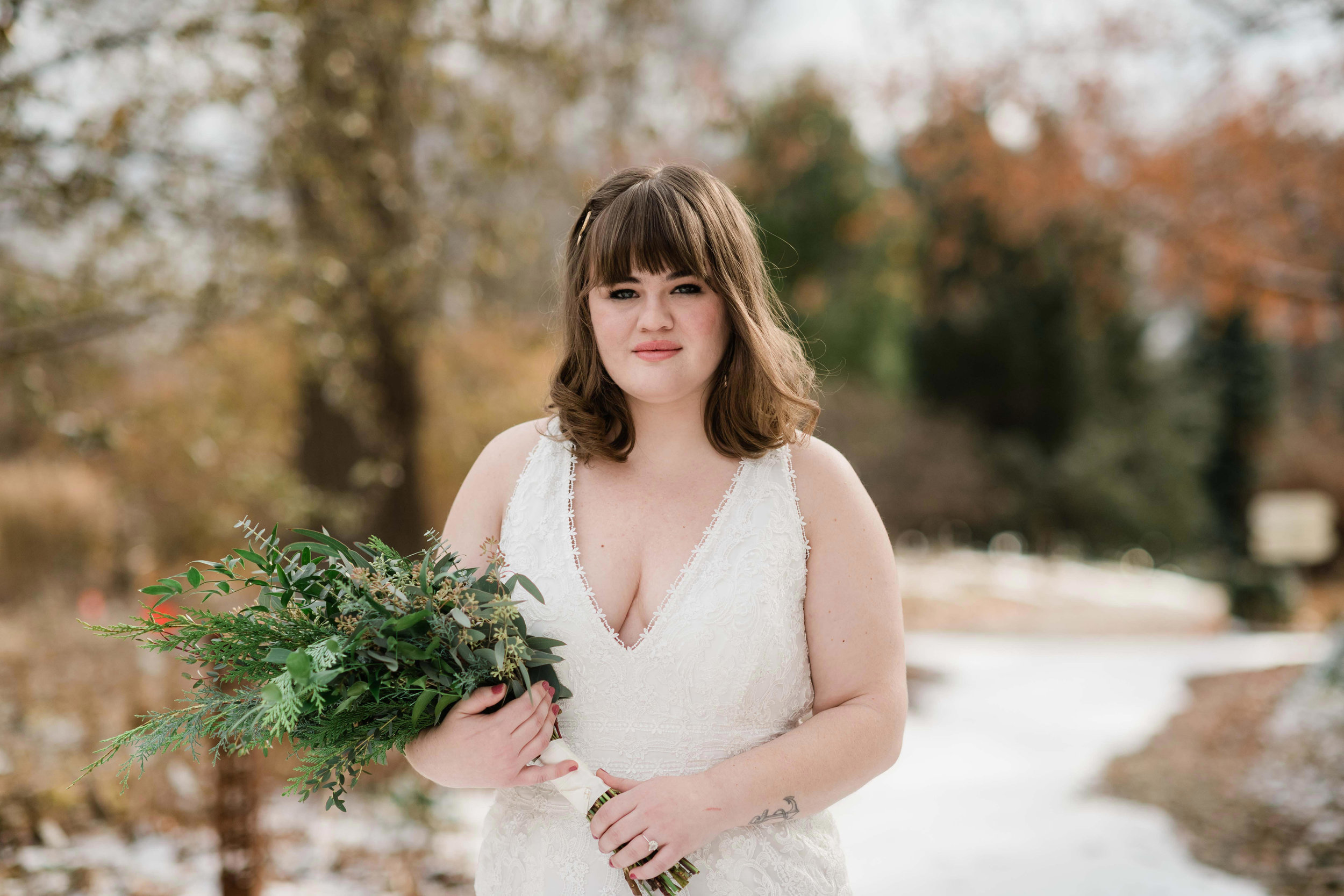 Bride holding her bouquet with a serious expression