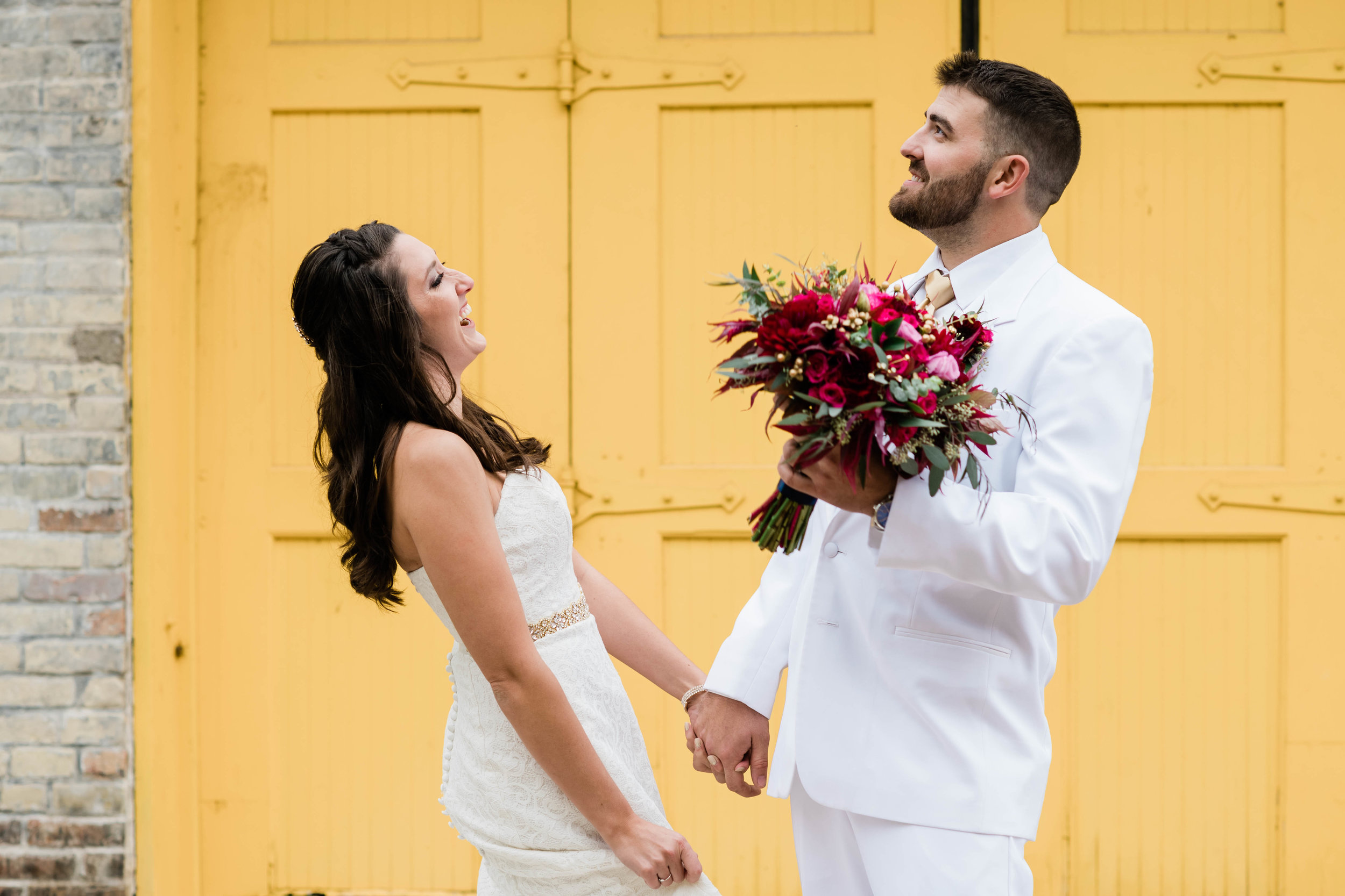 Groom making bride laugh