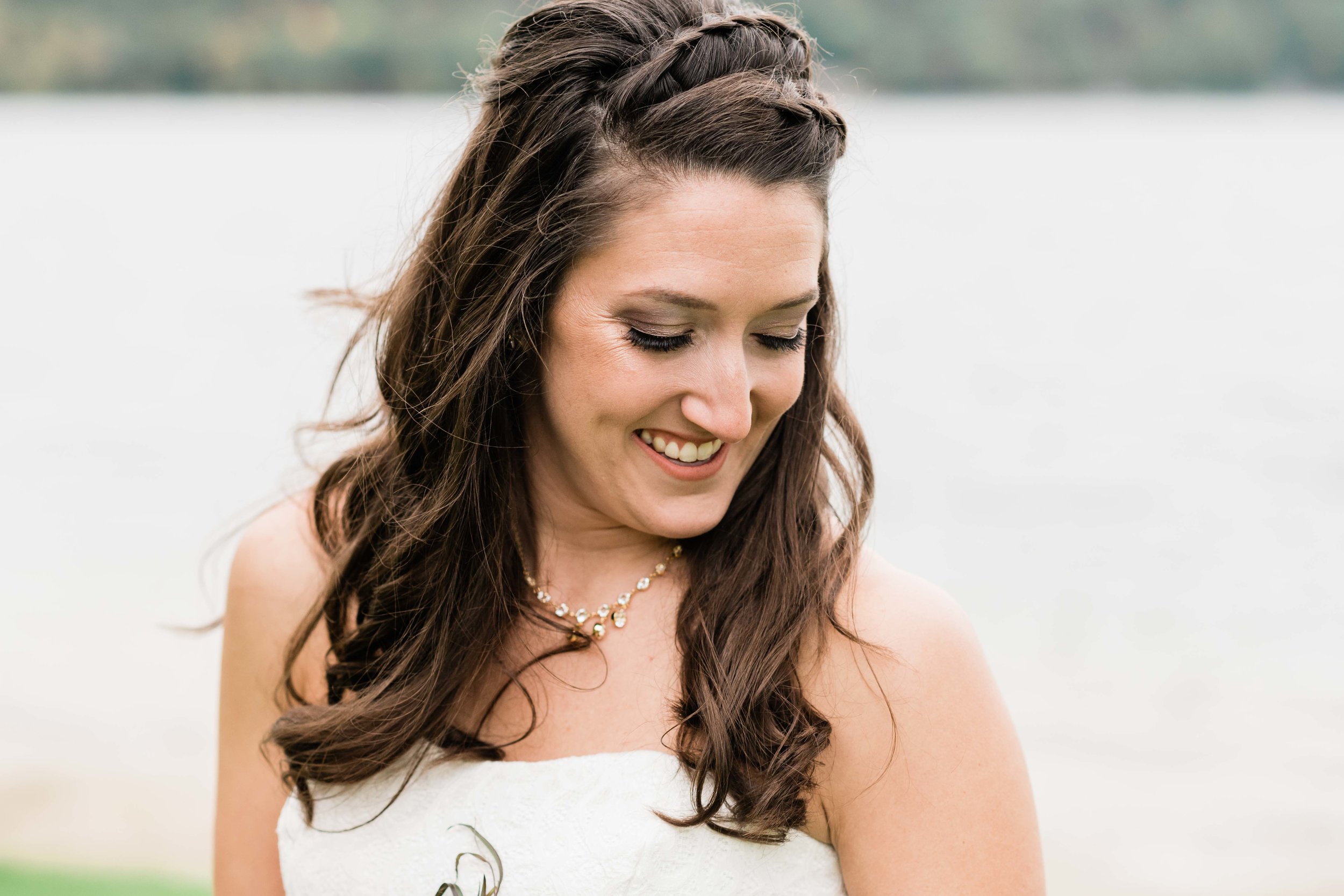 Bride looking down at her bouquet