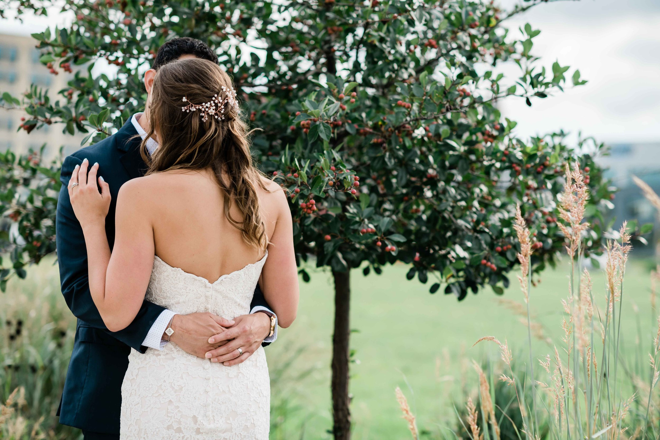 Bride and groom hold each other