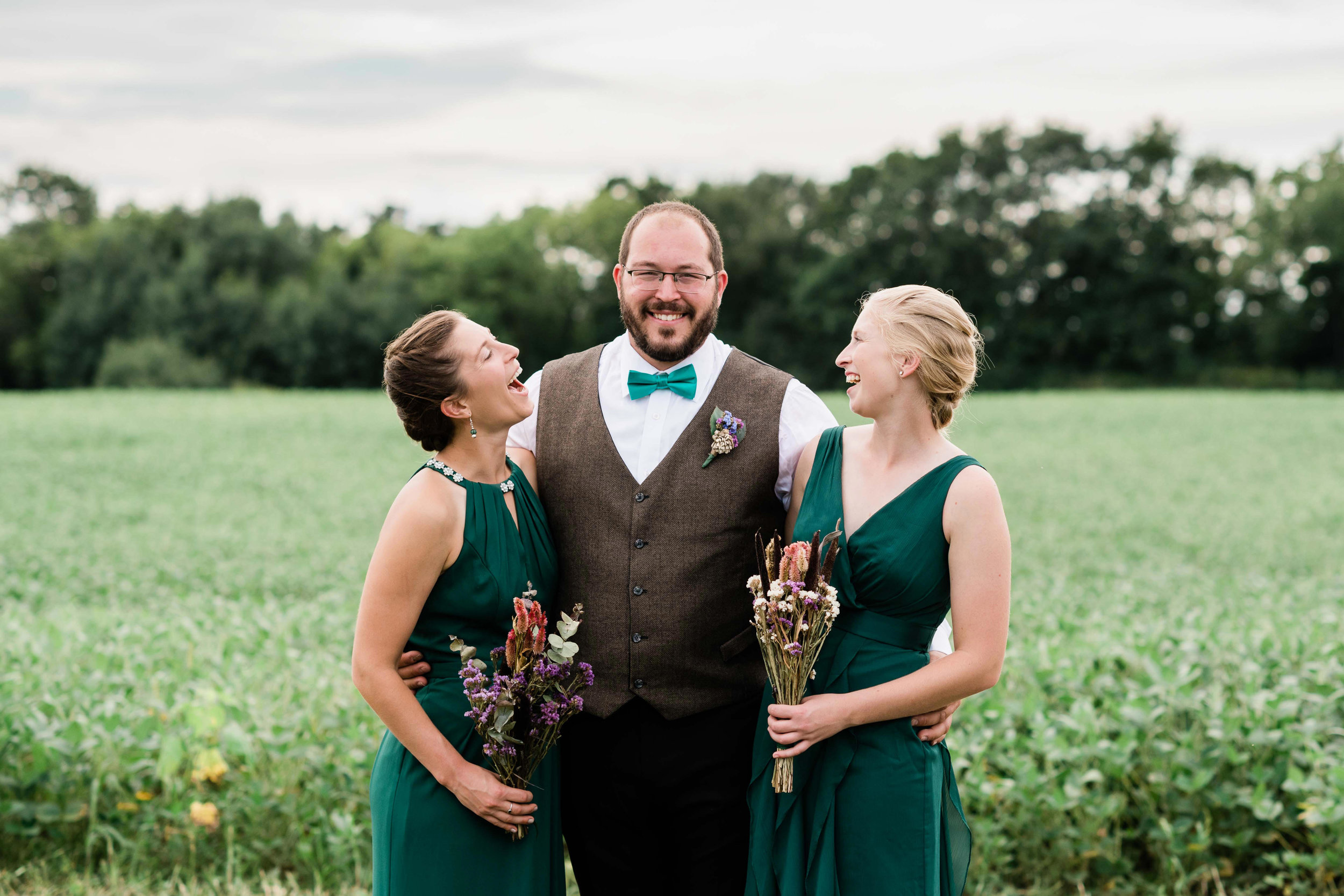 Bridesmaids admiring groom