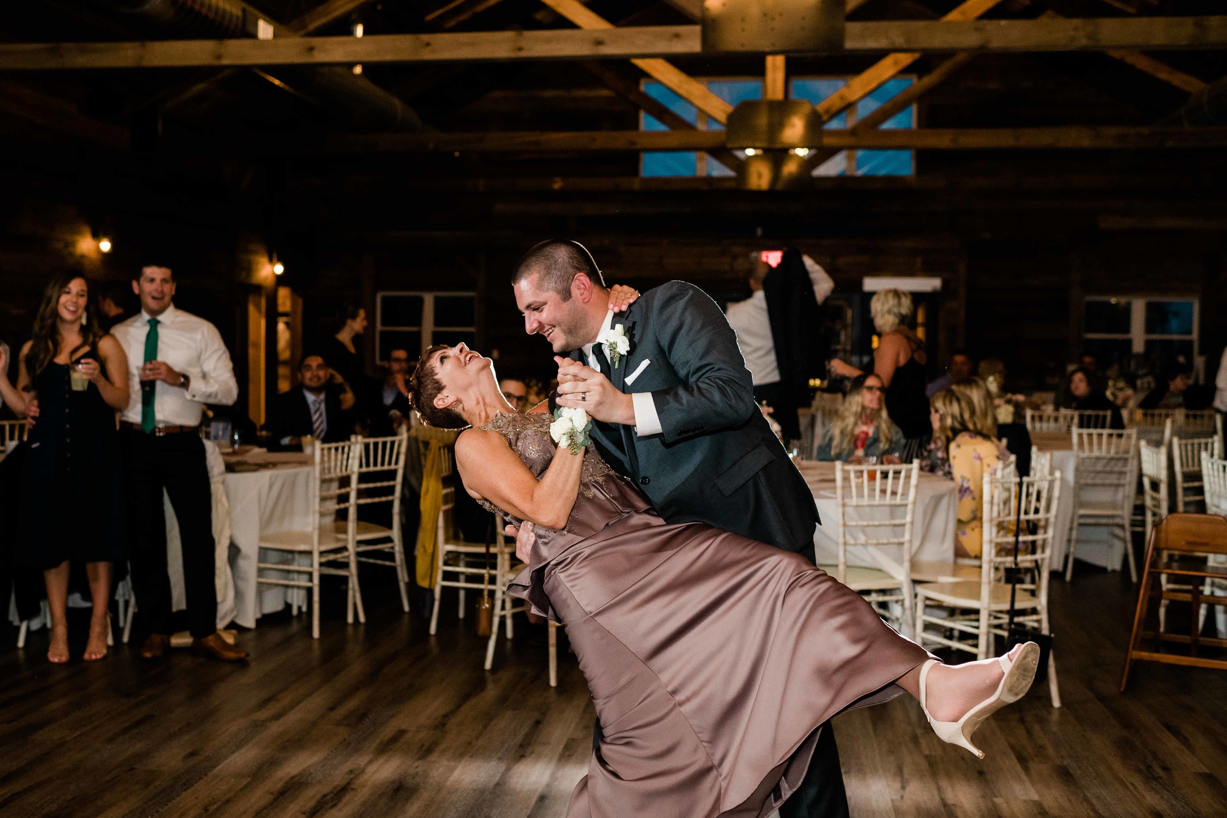 Groom dips his mom during dance