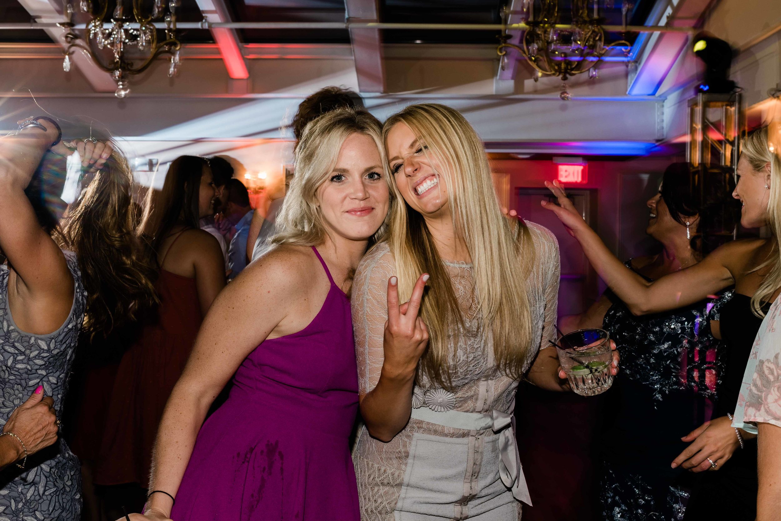 Wedding guest gives the peace sign