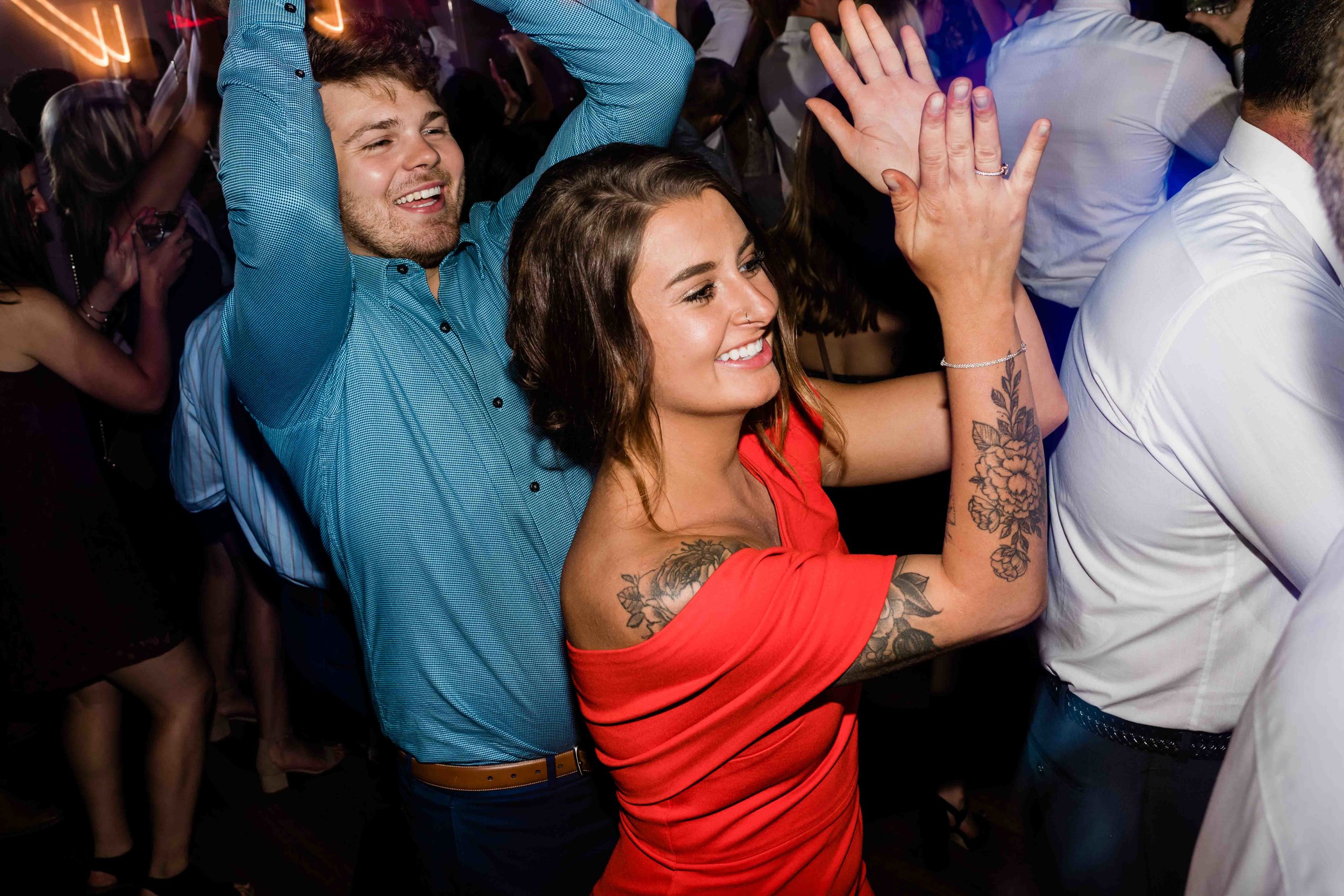 Wedding guests clapping on the dance floor