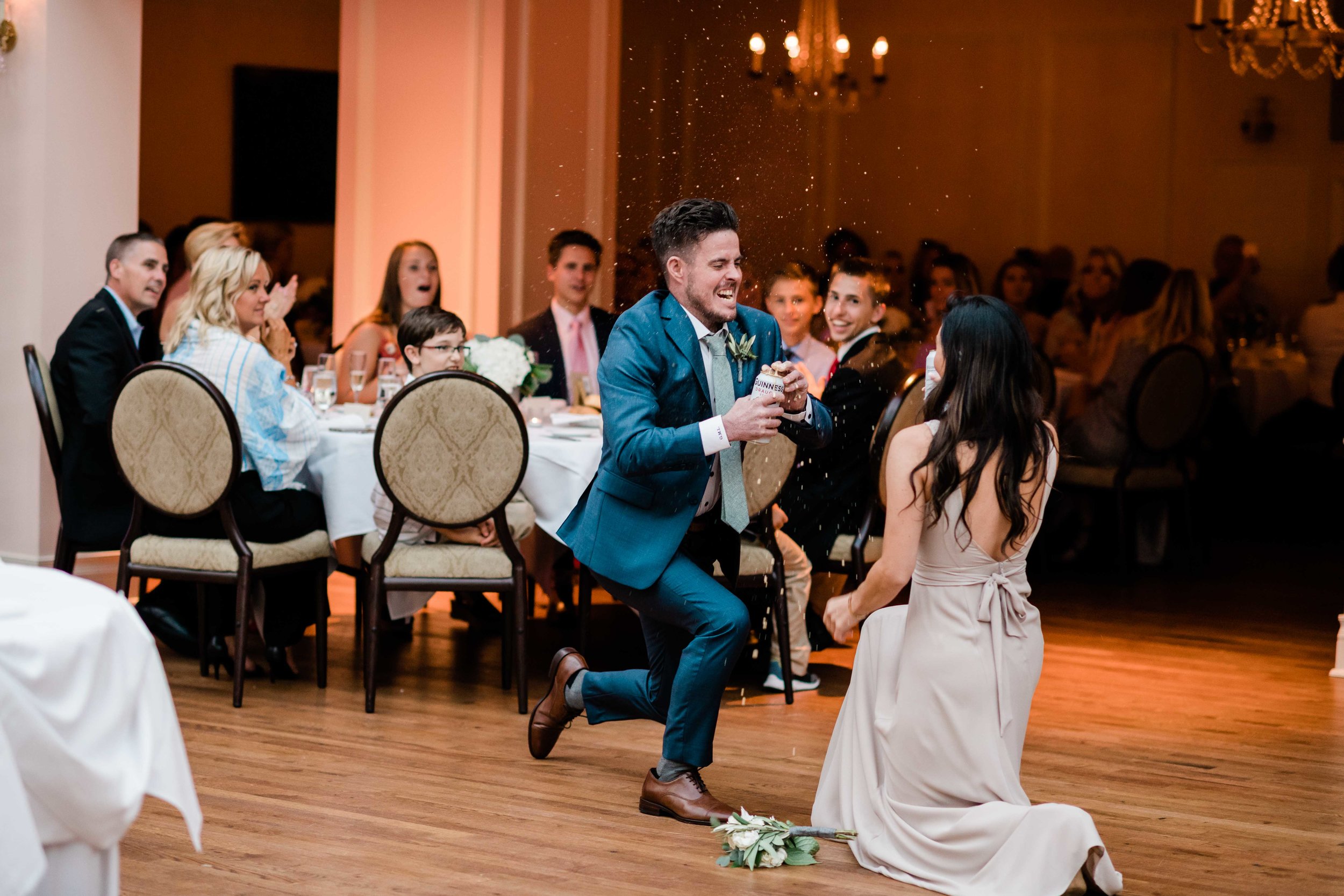 Groomsmen opens beer during grand entrance