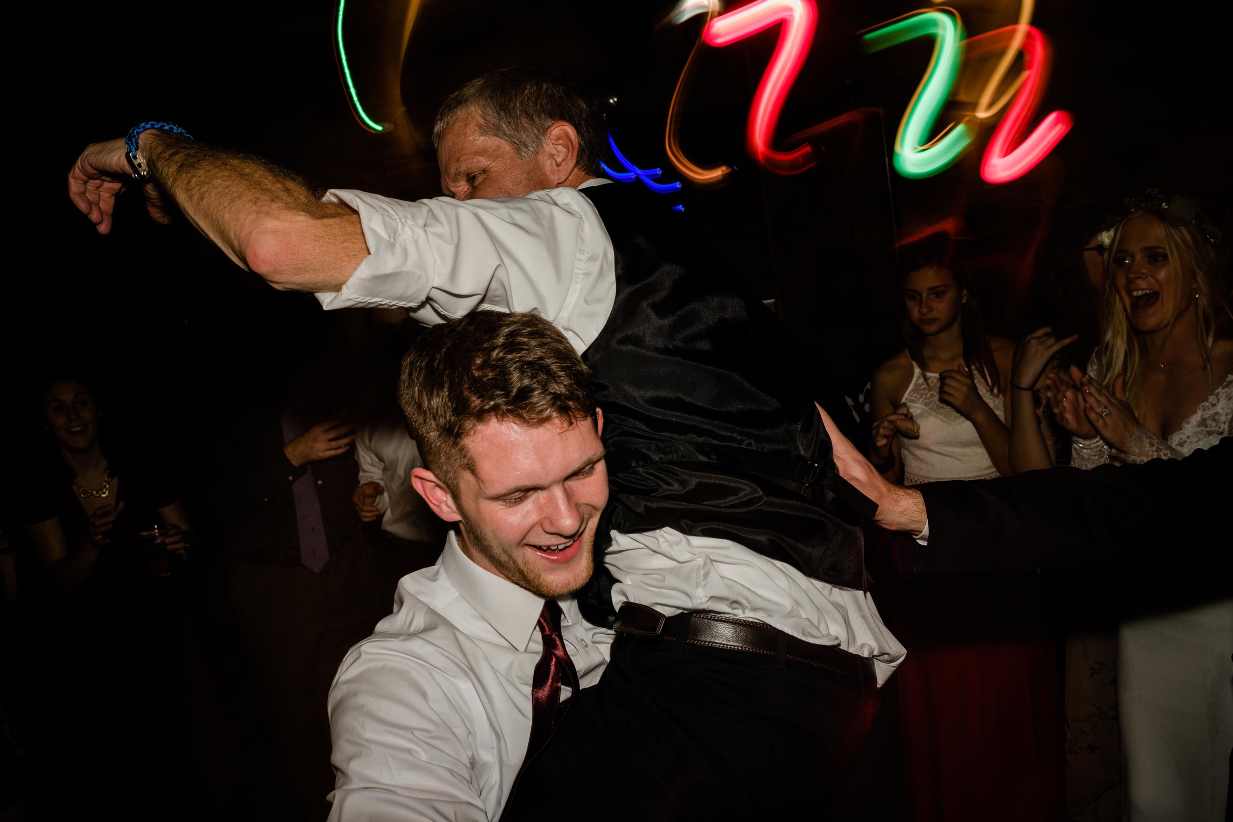 Wedding guest picks up father of the groom