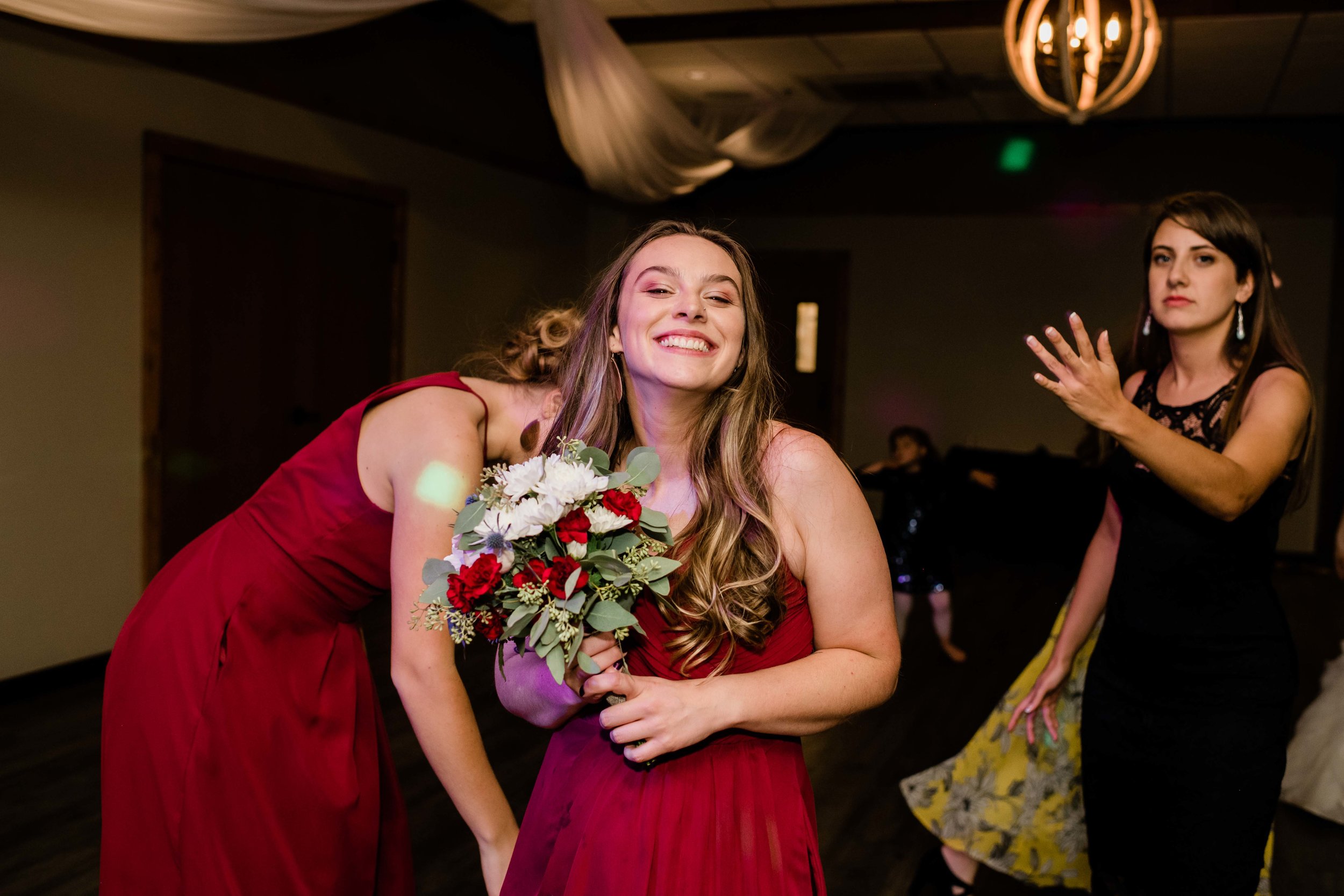 Bridesmaid catches bouquet