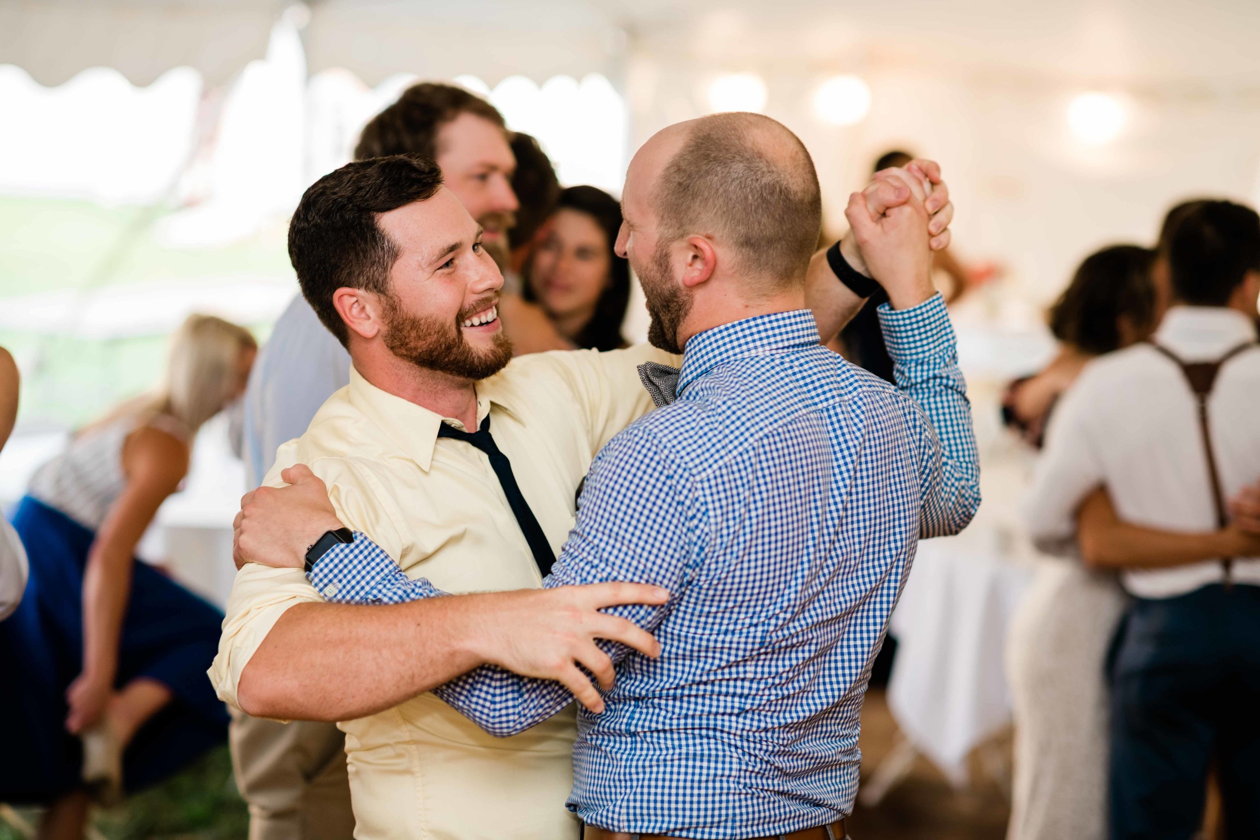 Wedding guests happily dancing