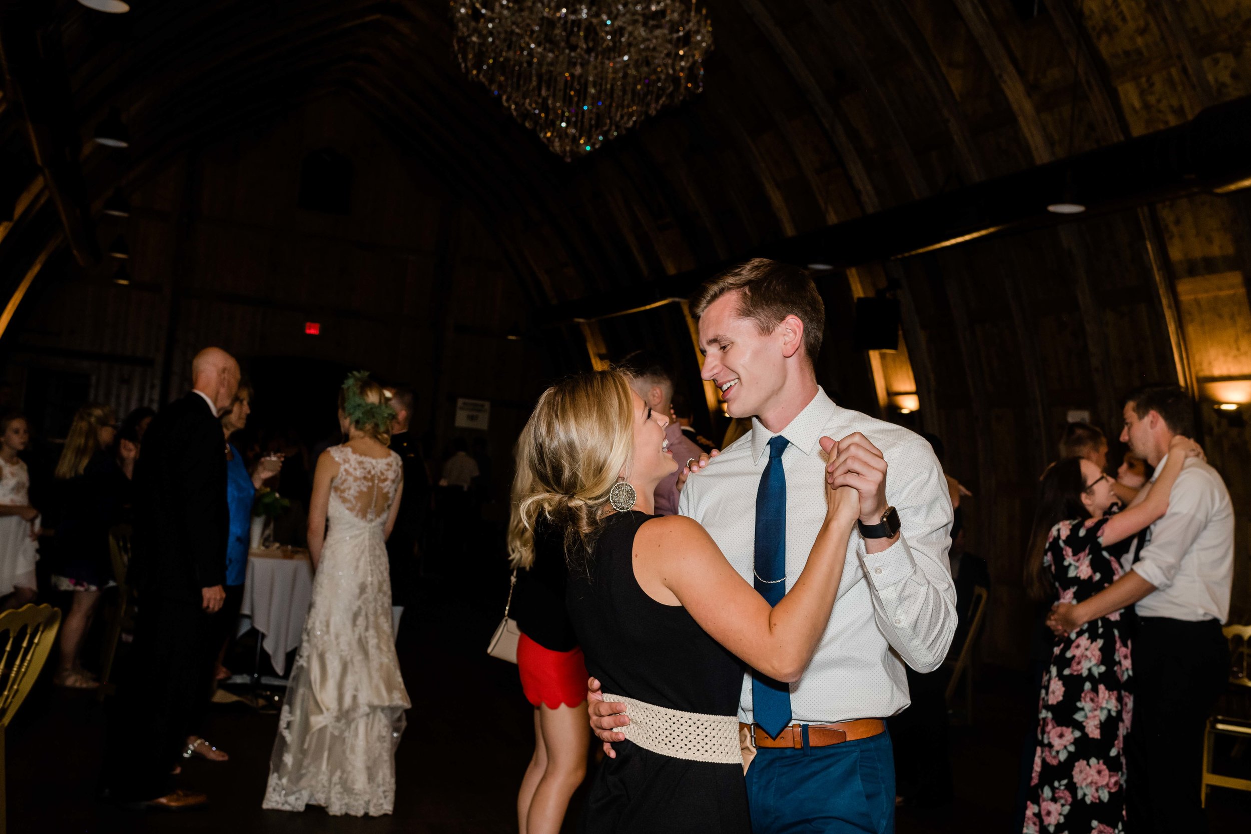 Wedding guests slow dance