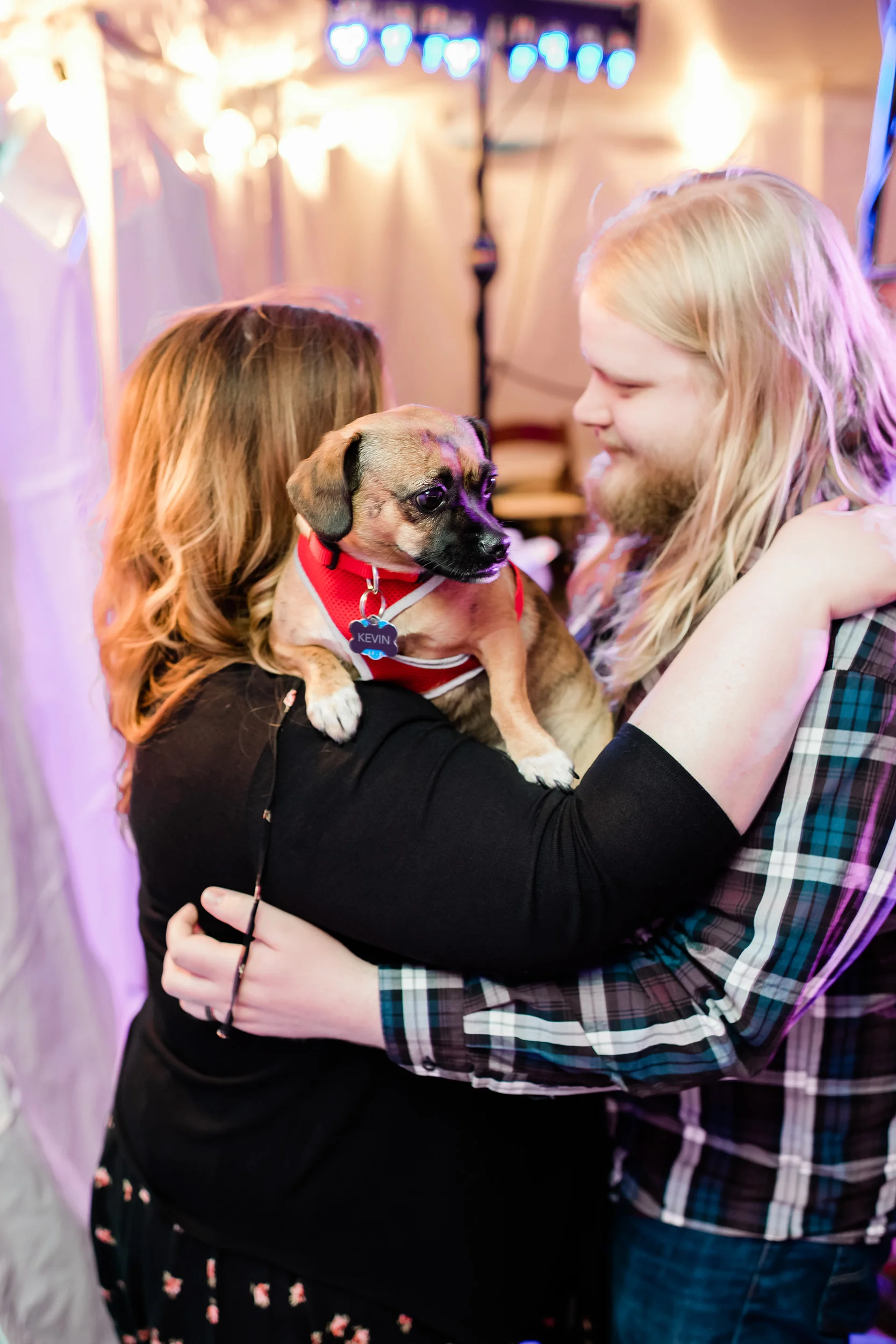 Wedding guests slow dancing with their dog