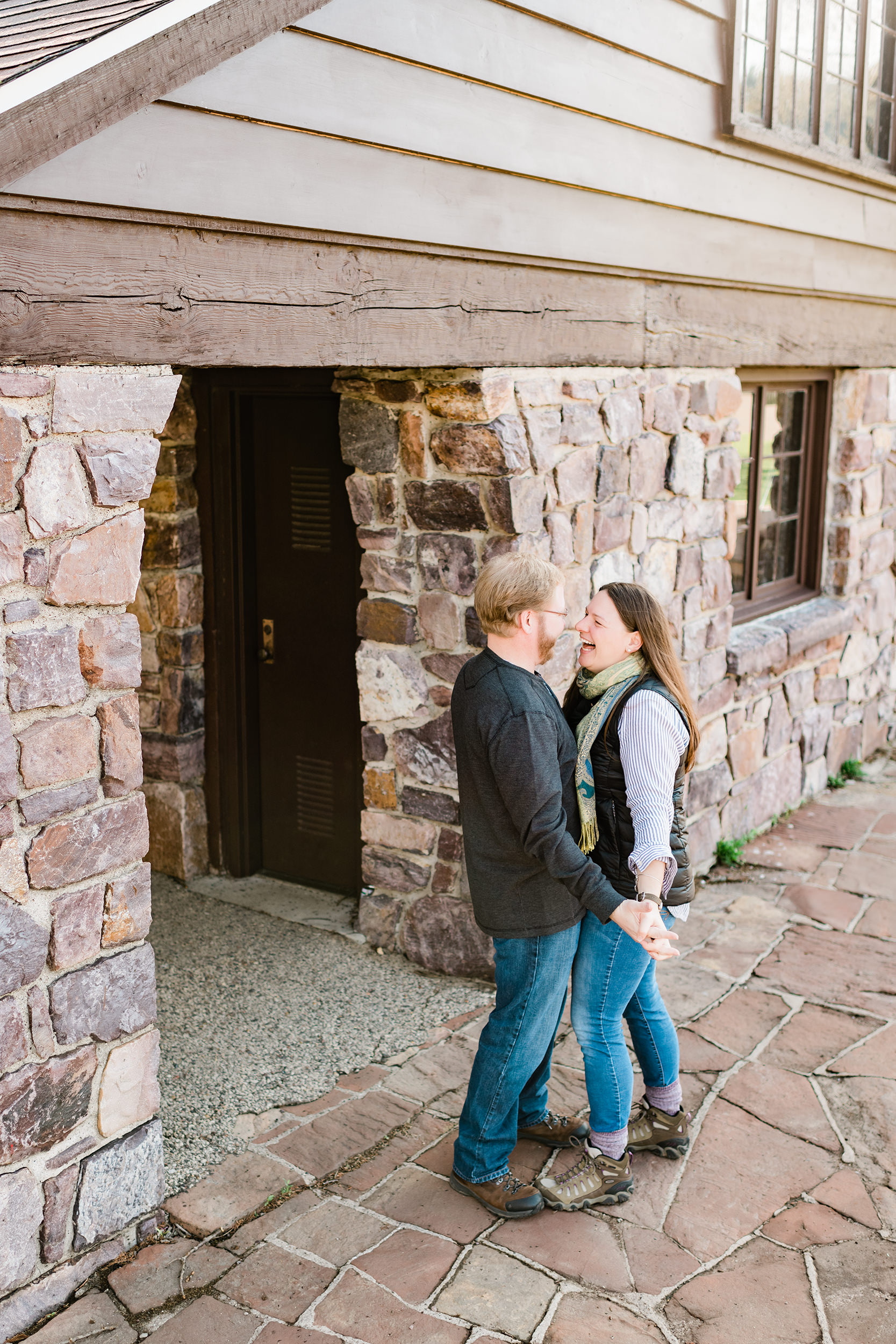 Engaged couple hand in hand at Devil's Lake State Park
