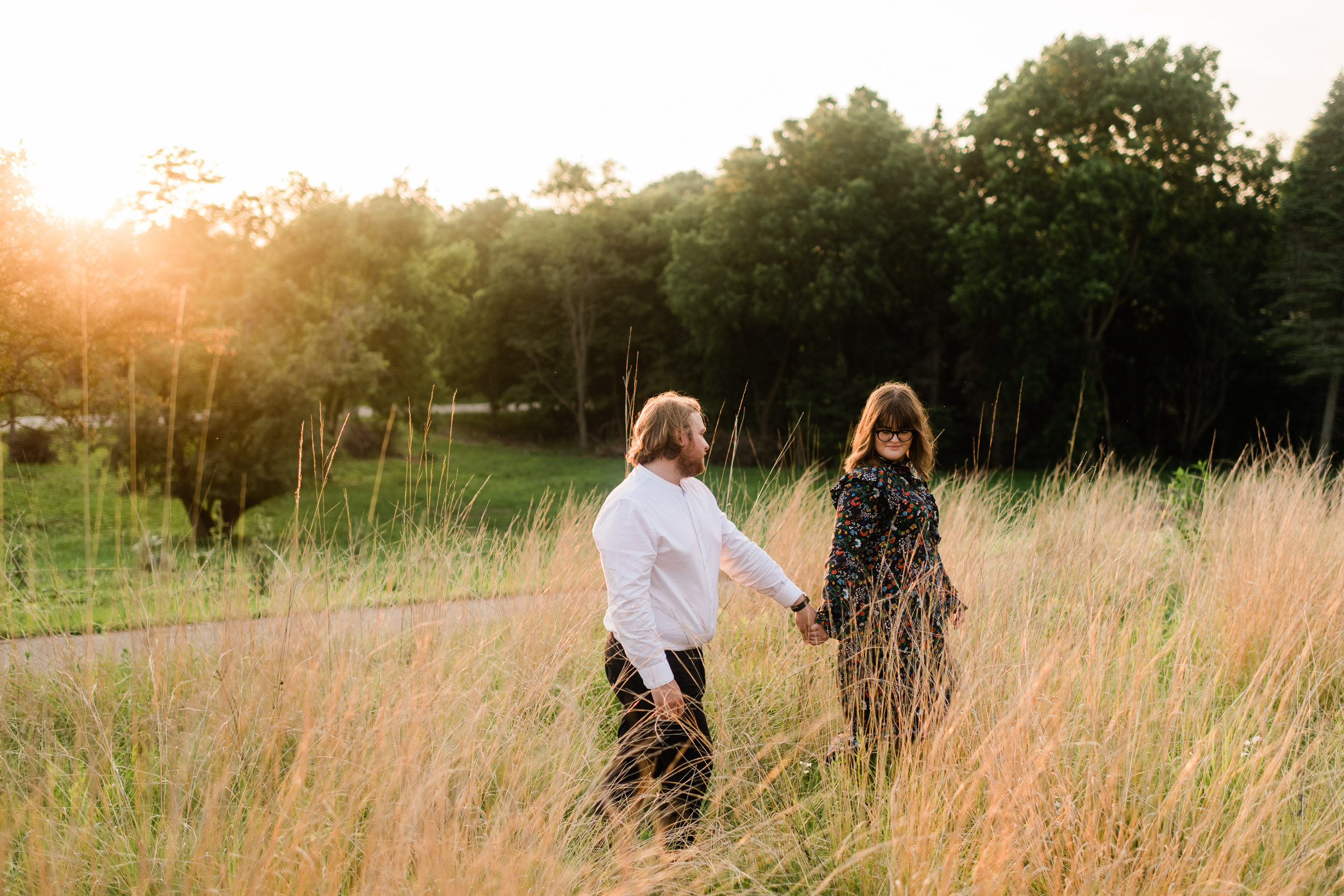 Engaged couple in a field