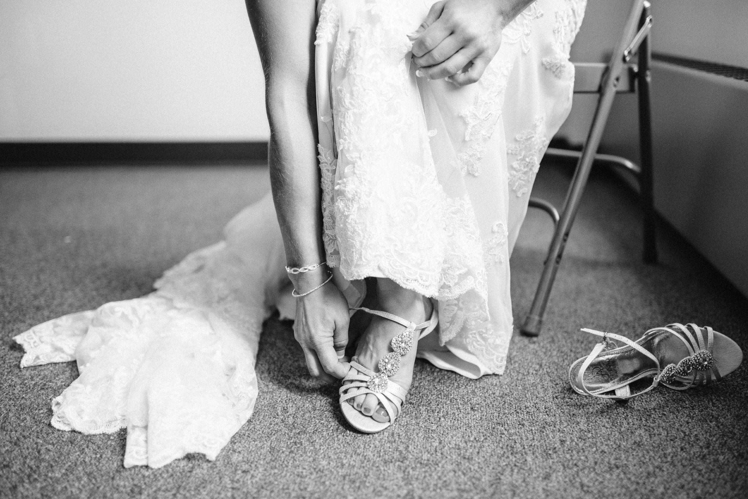 Bride putting on her shoes