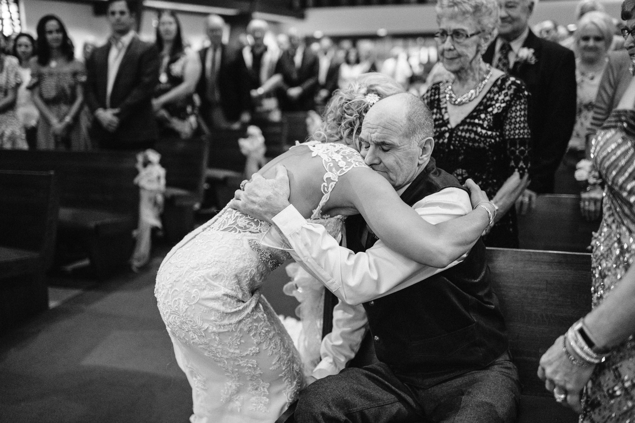 Bride hugging father