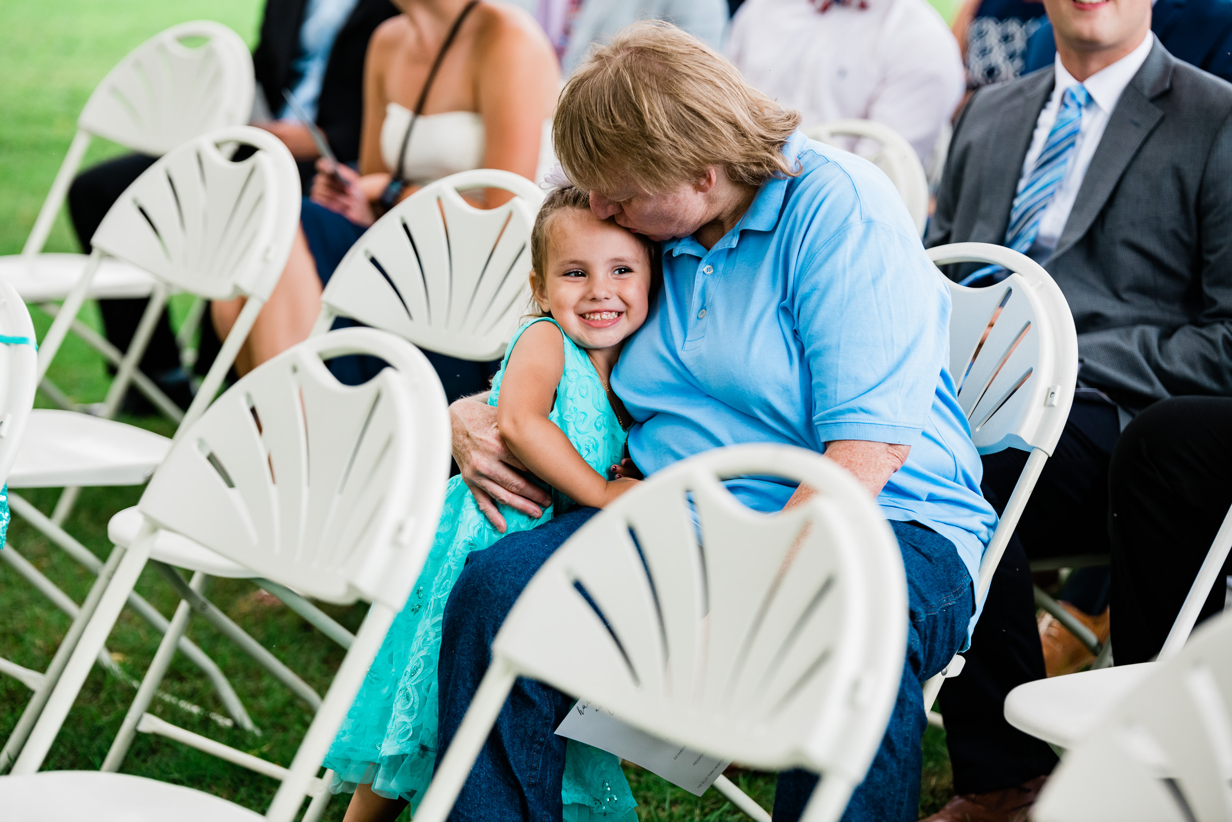 Woman kissing child