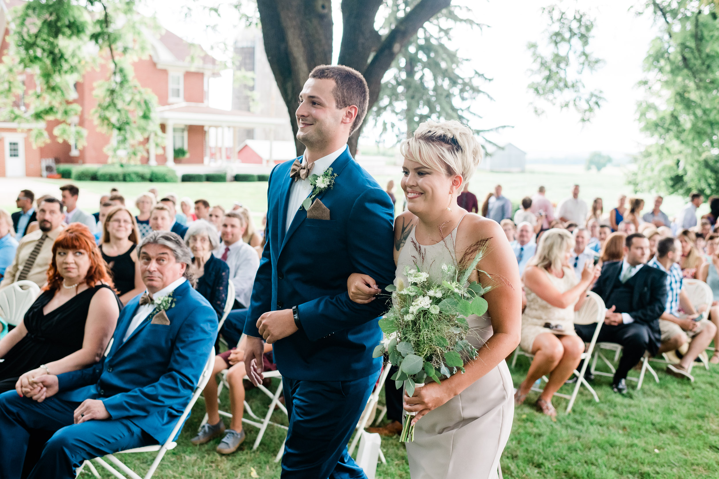 Groomsman and bridesmaid walking down the aisle