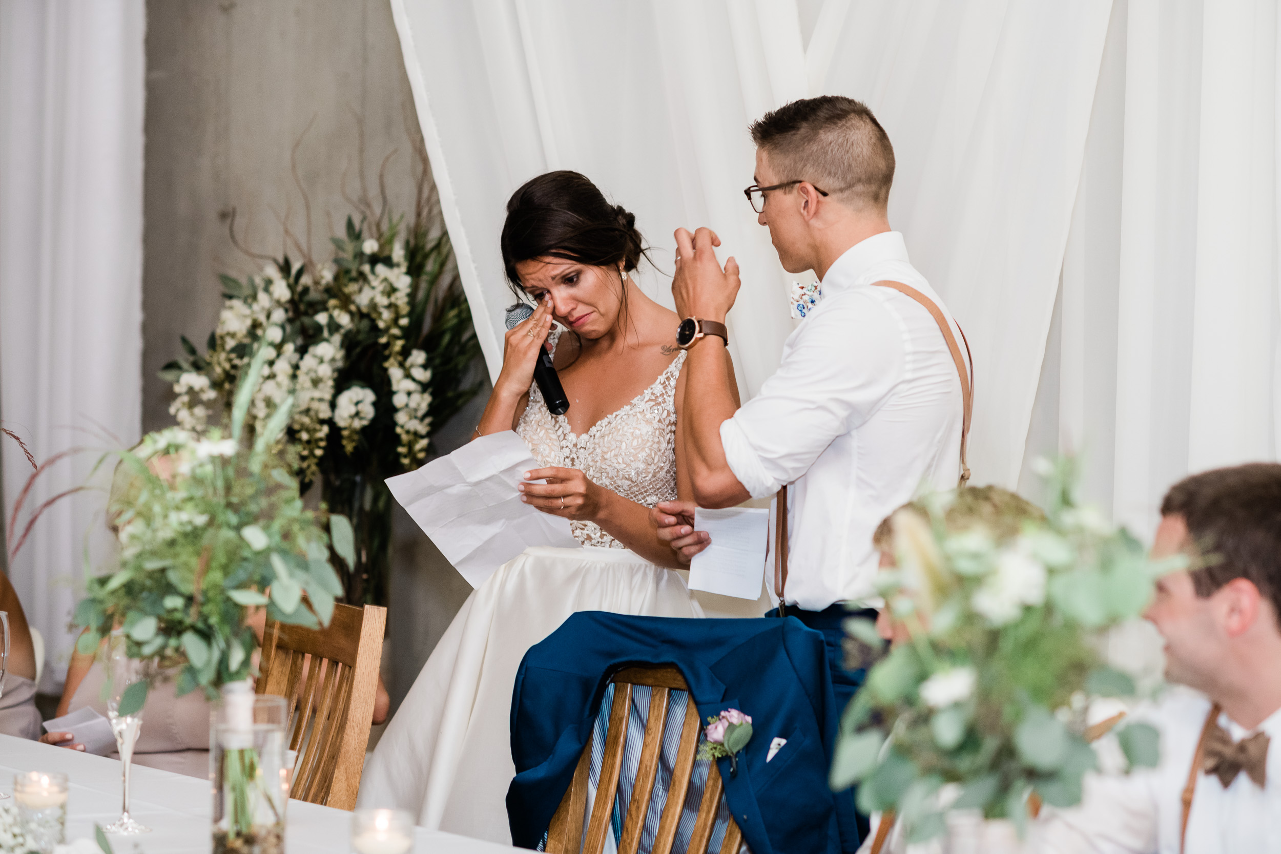 Bride crying while giving a thank you speech