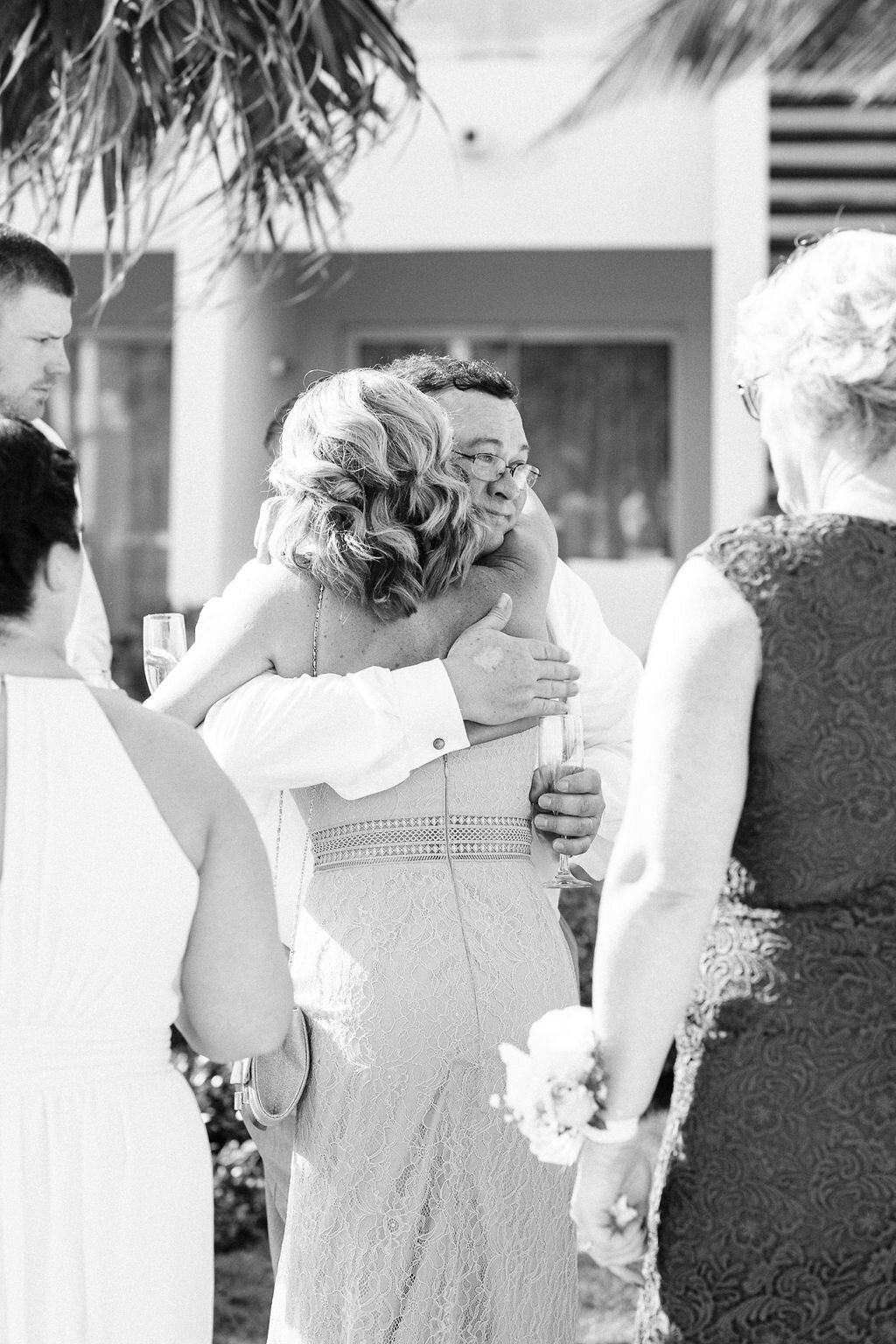 Wedding guests hugging