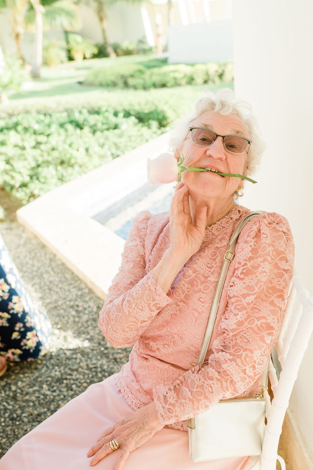 Grandma holding a rose in between her teeth