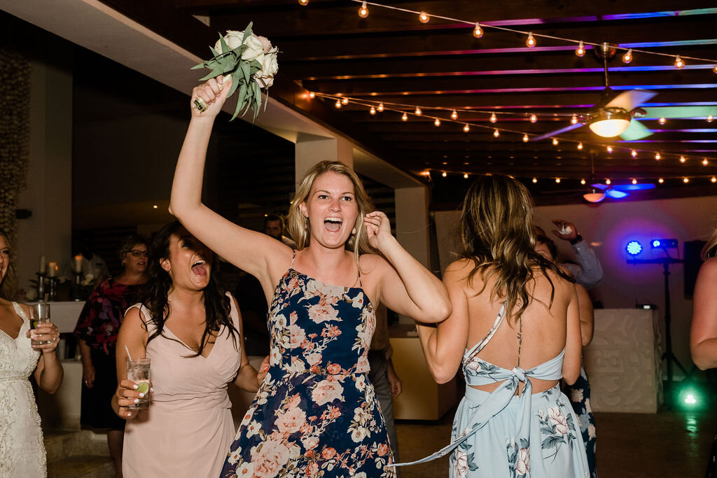 Wedding guest catches bridal bouquet