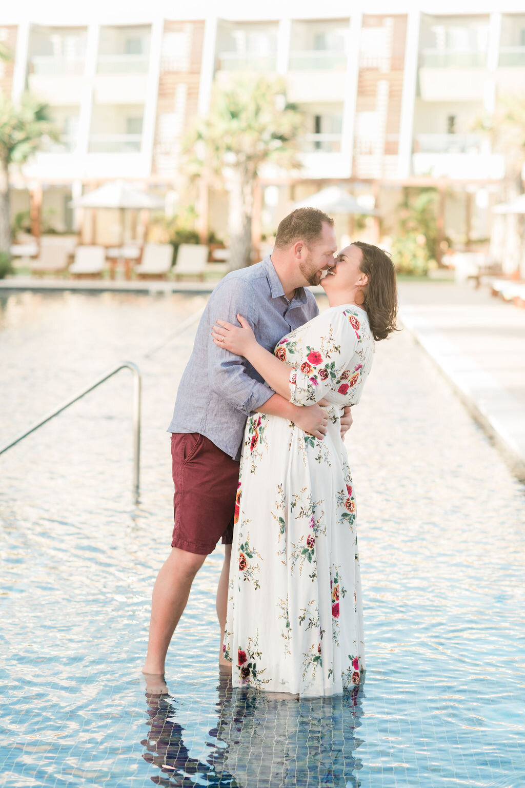 Man dips his fiancé in the pool