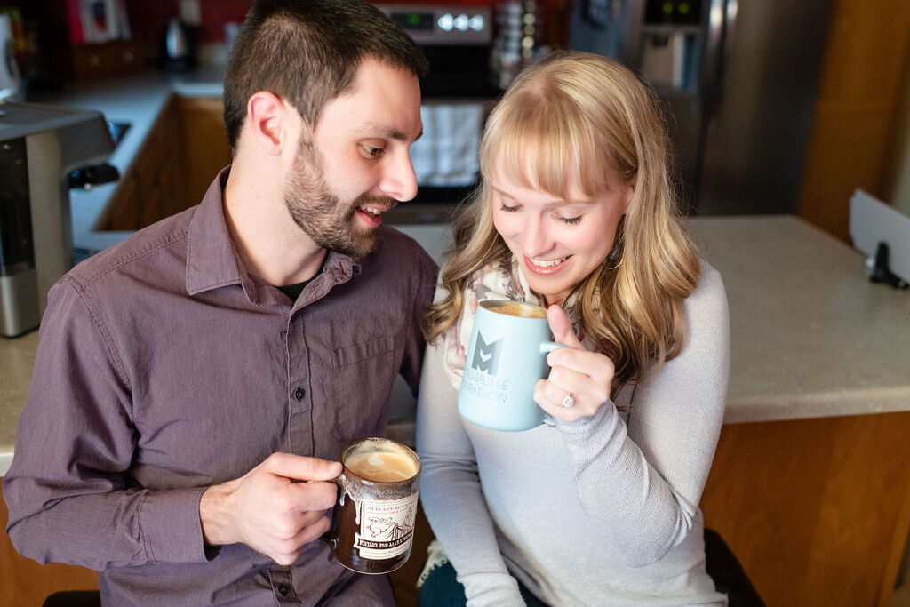 Engaged couple drinking lattes