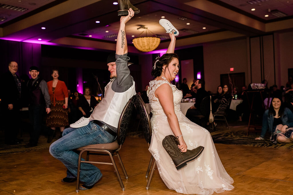 Bride and groom playing the shoe game